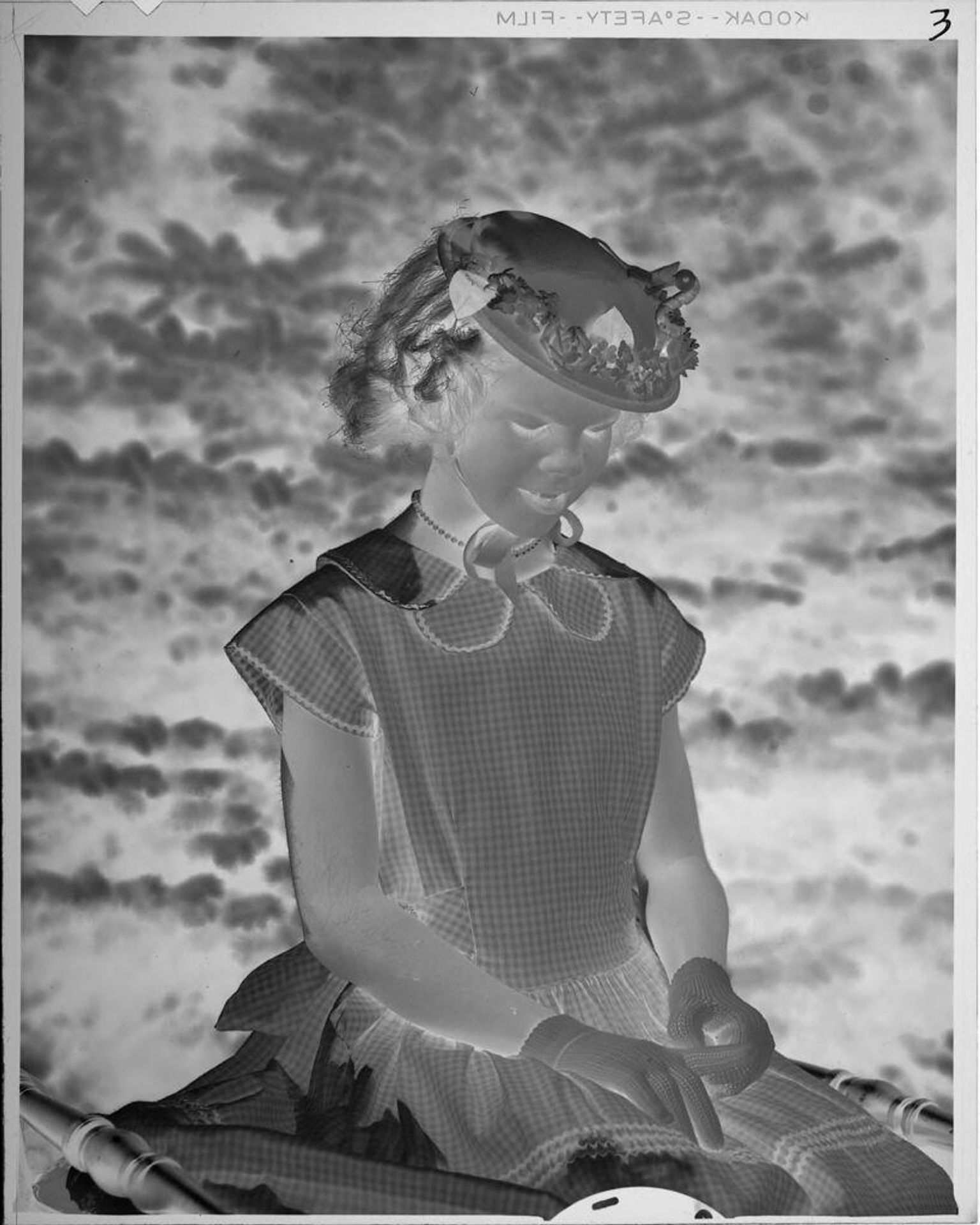 Untitled (girl in hat and gingham dres) by Lucian and Mary Brown