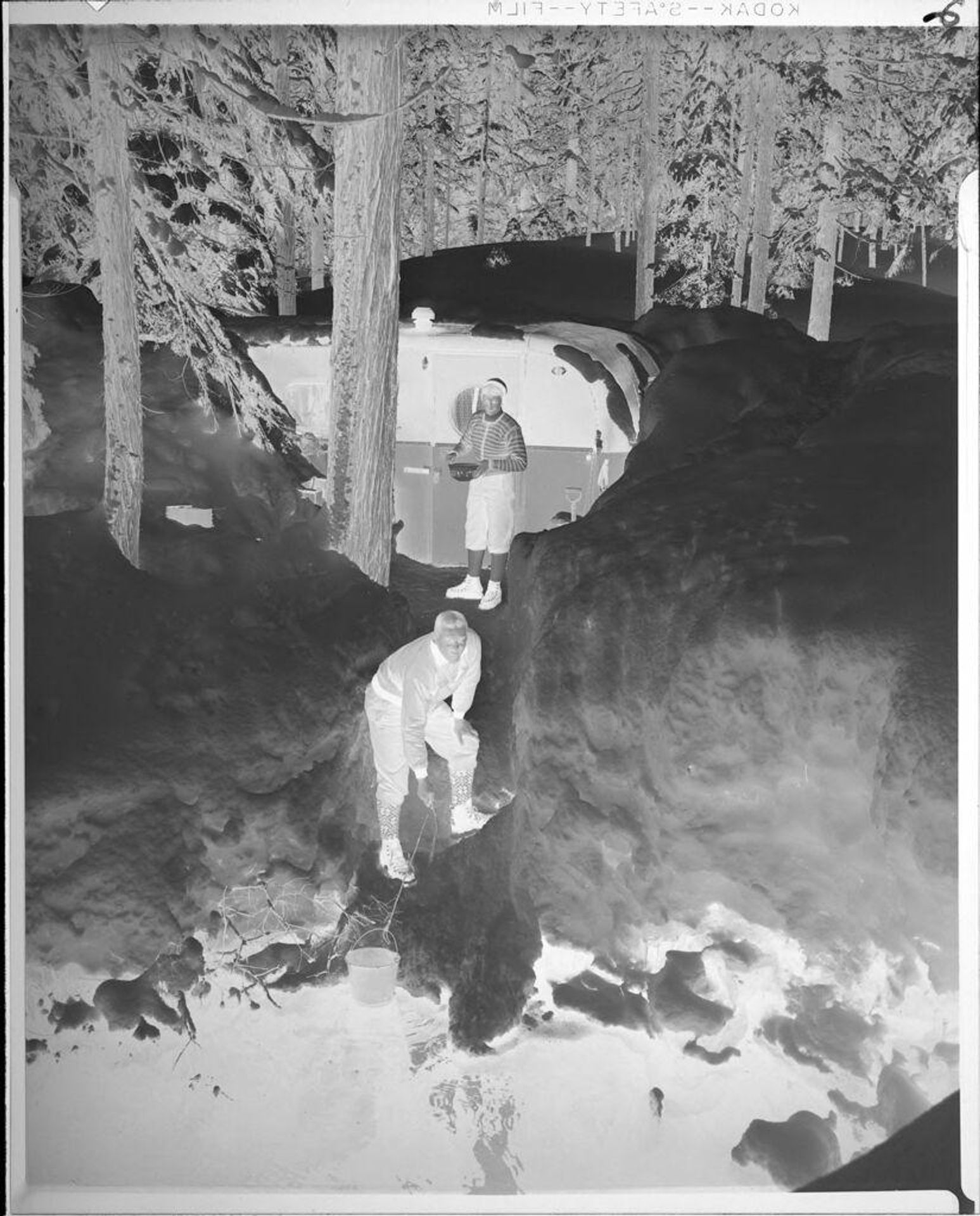 Untitled (man and woman in snowed-in trailer) by Ken Whitmire Associates