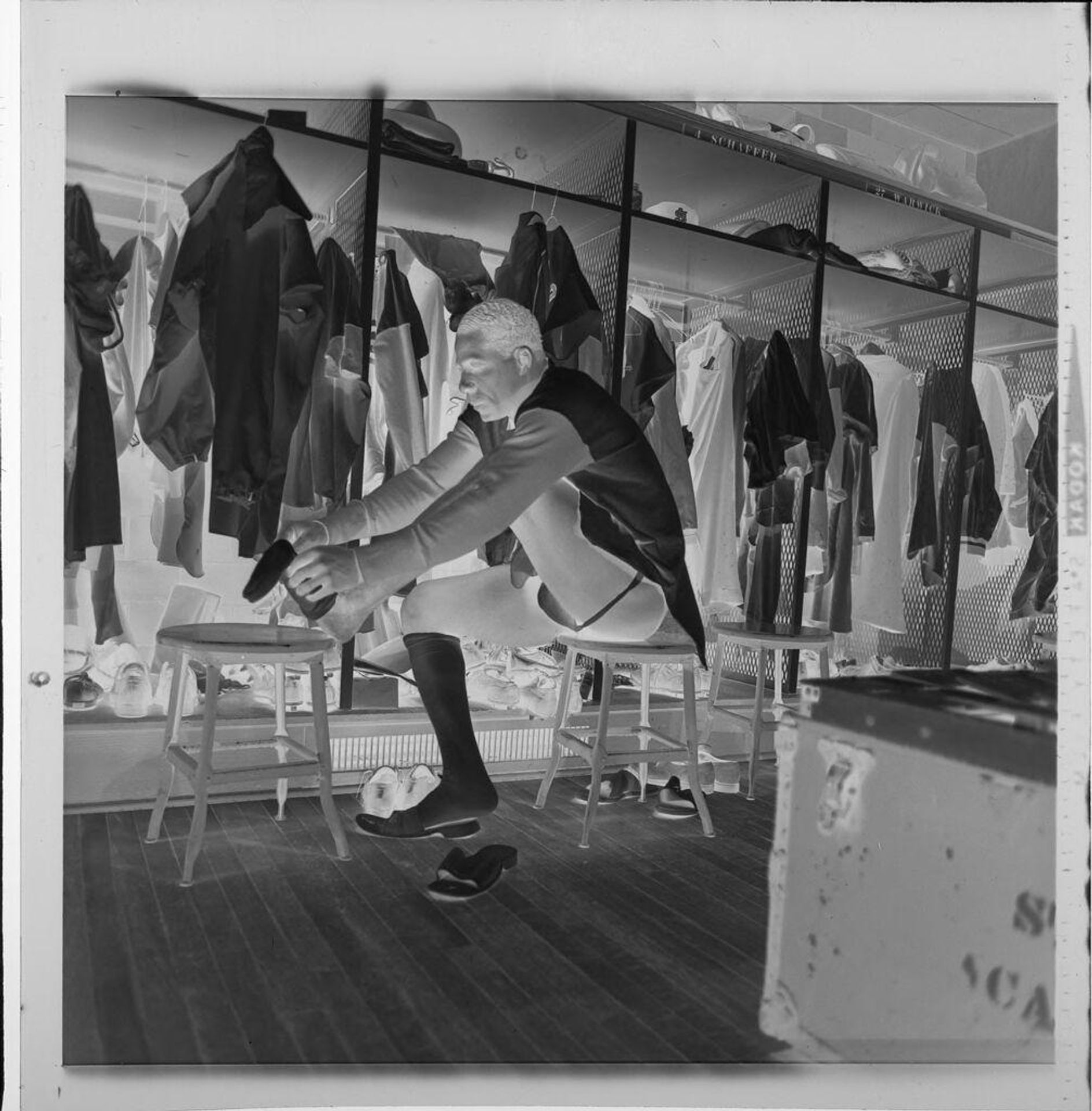 Untitled (Cardinal baseball player Minnie Minuso sitting in locker room) by Jack Gould