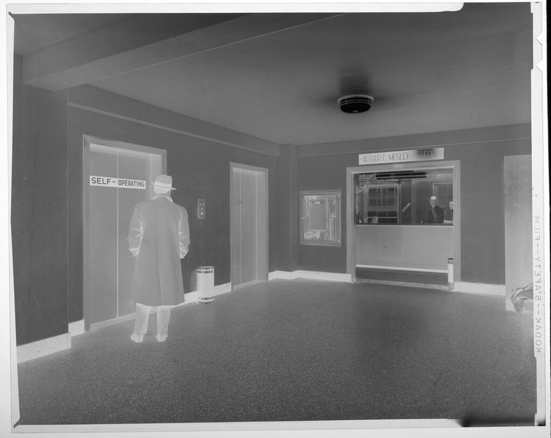 Untitled (man waiting for elevator in Police Department) by Jack Gould