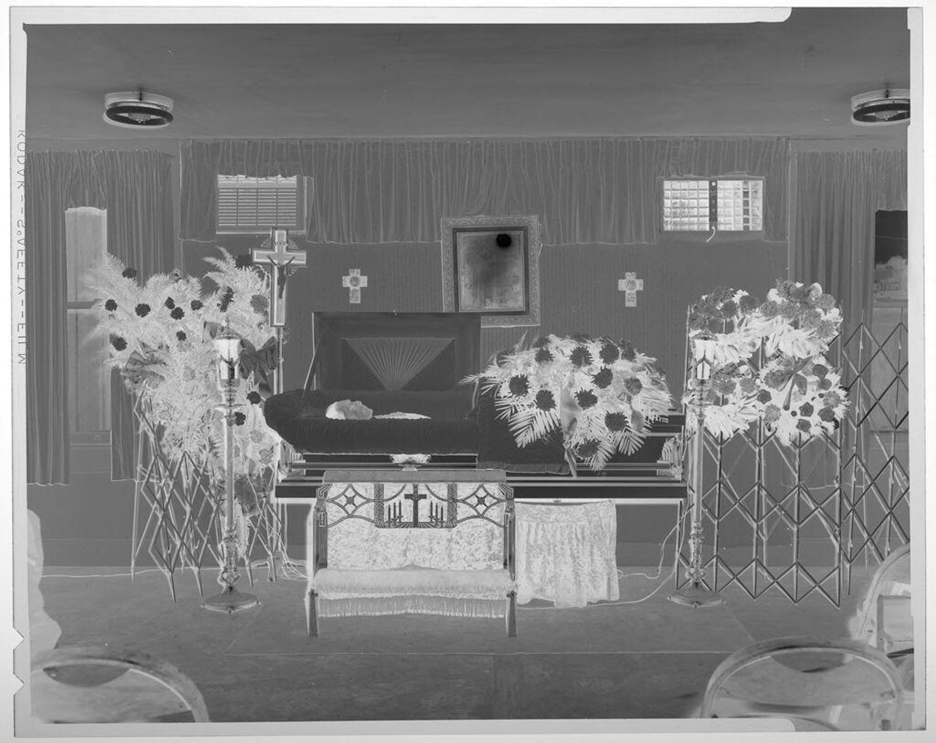 Untitled (deceased man in coffin in funeral home) by Harry Annas