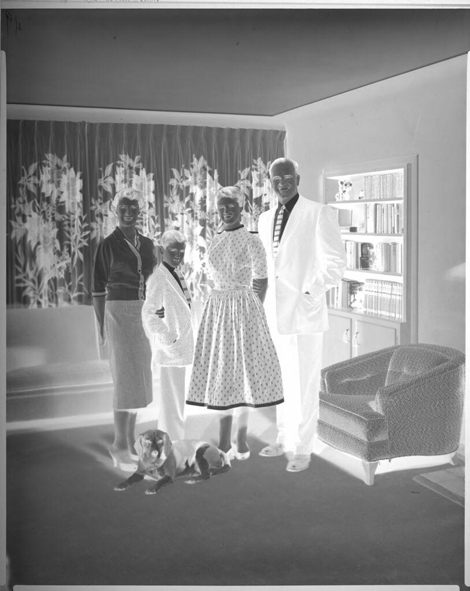 Untitled (family portrait in living room) by Lainson Studios