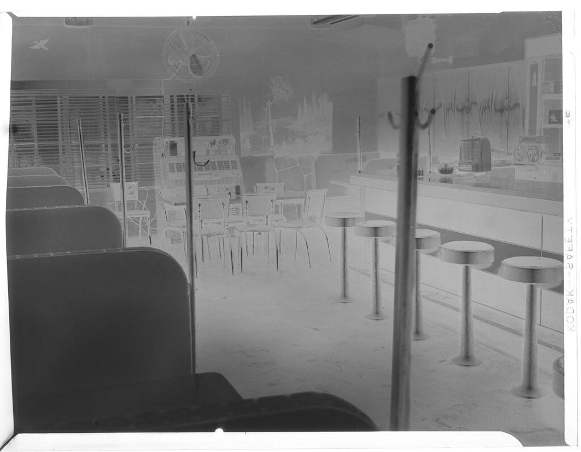 Untitled (Lee's Esso Grill, interior, booths and table seating, jukebox) by Hamblin Studio