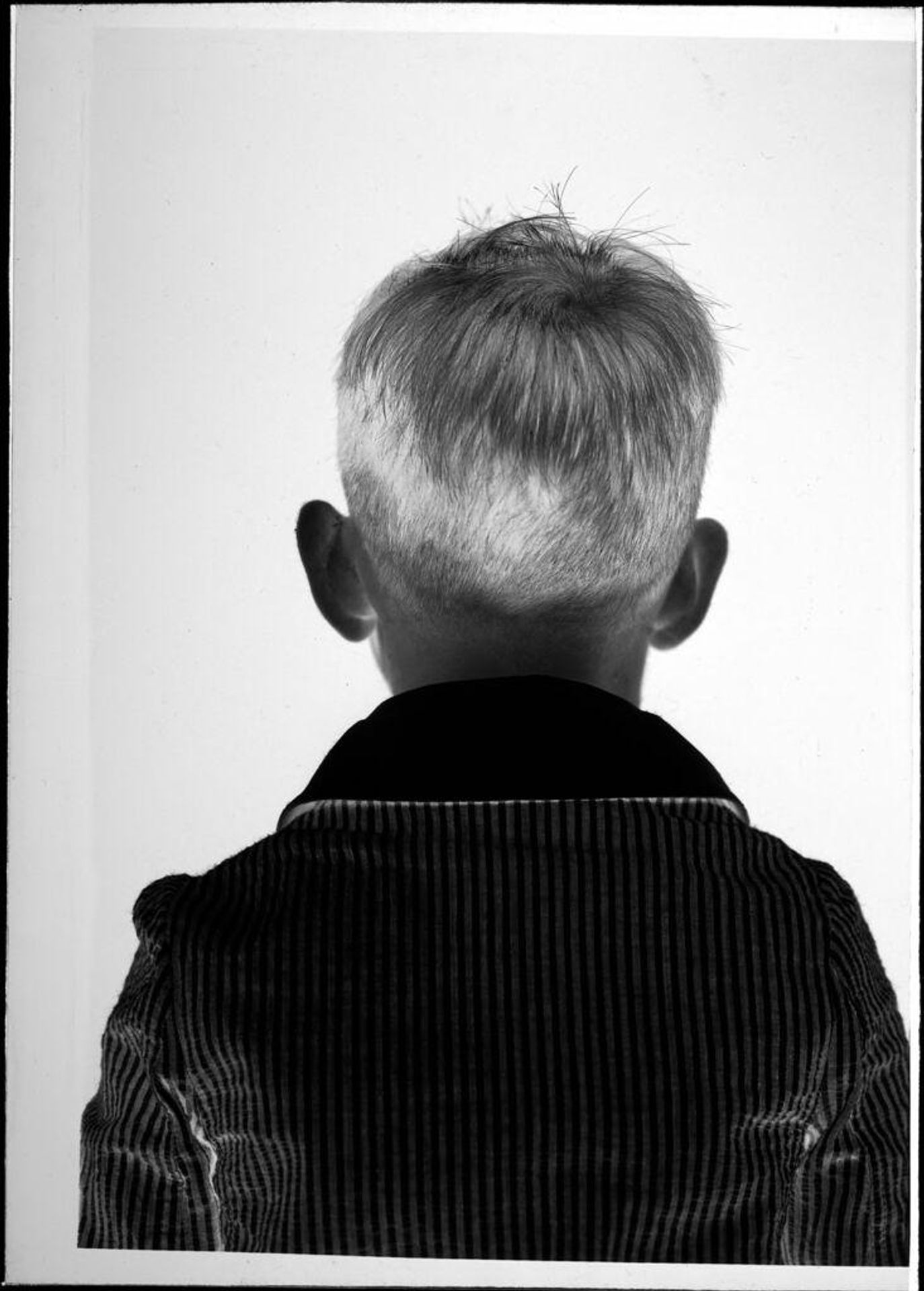 Untitled (back of boy's head) by Robert Burian
