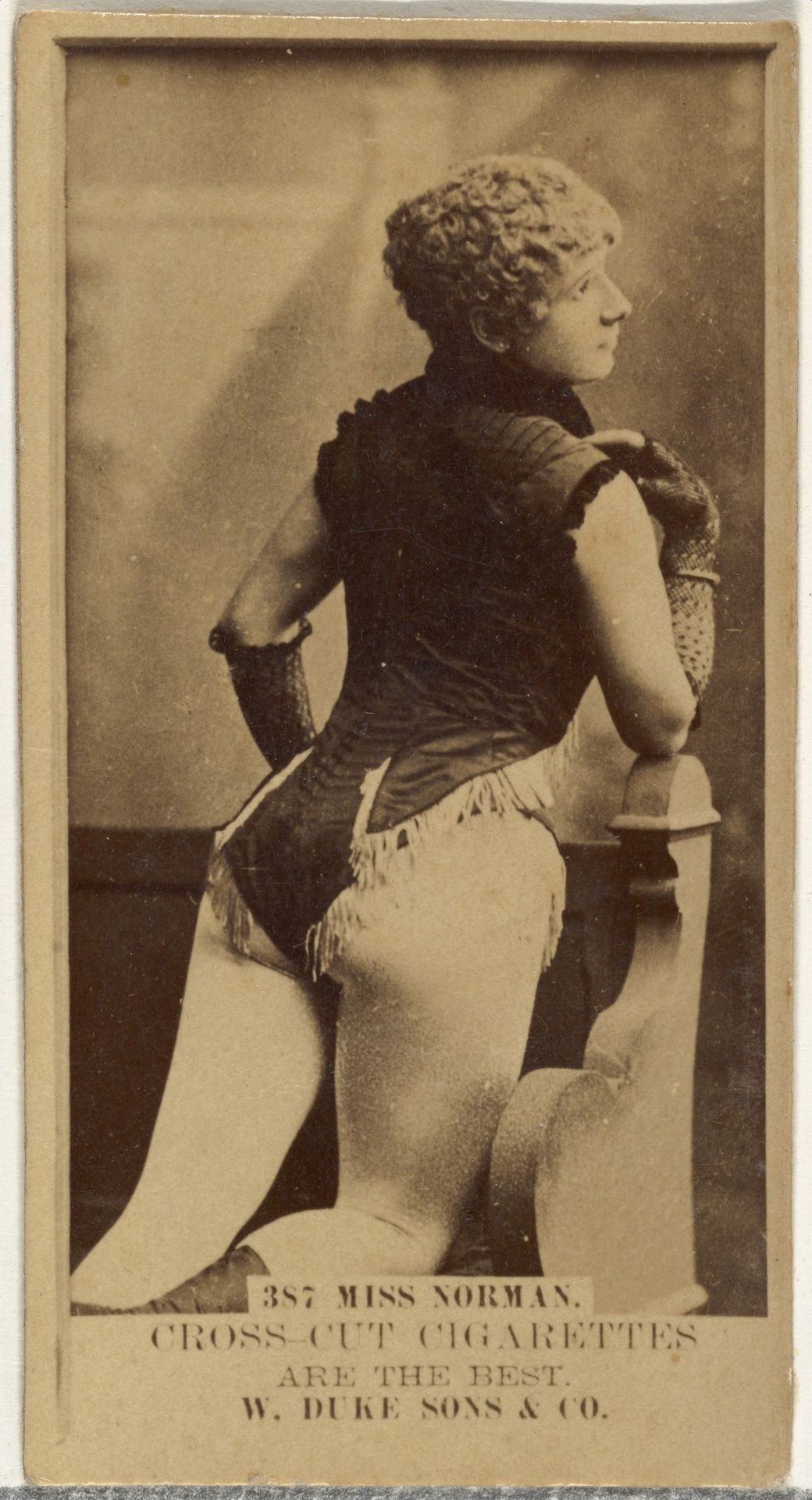 Card Number 387, Miss Norman, from the Actors and Actresses series (N145-3) issued by Duke Sons & Co. to promote Cross Cut Cigarettes by W. Duke, Sons & Co.