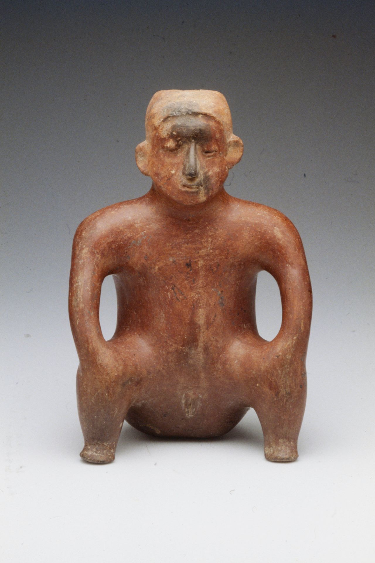 Seated female figure by Colima
