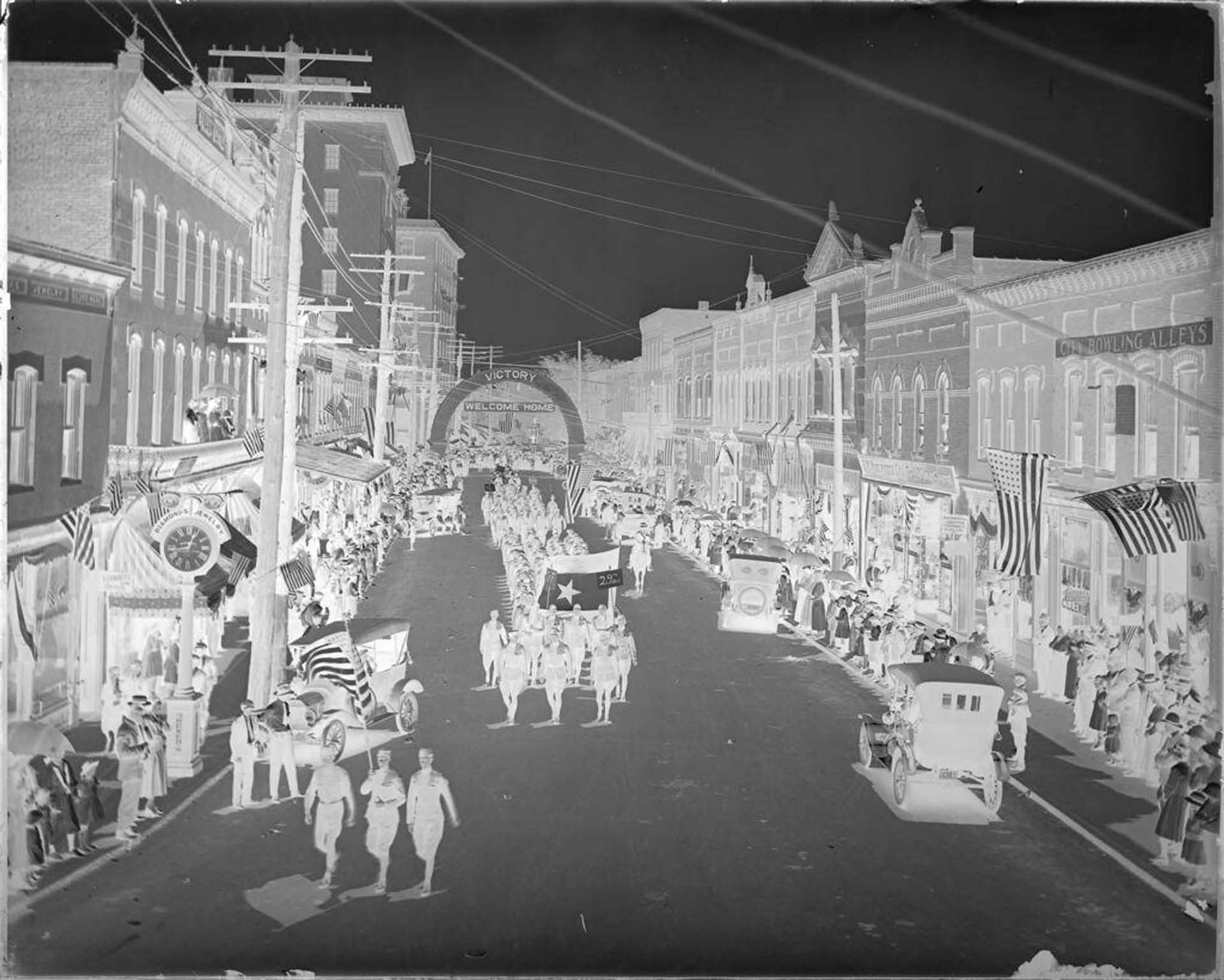 Untitled (July 4th parade down main street) by Hamblin Studio