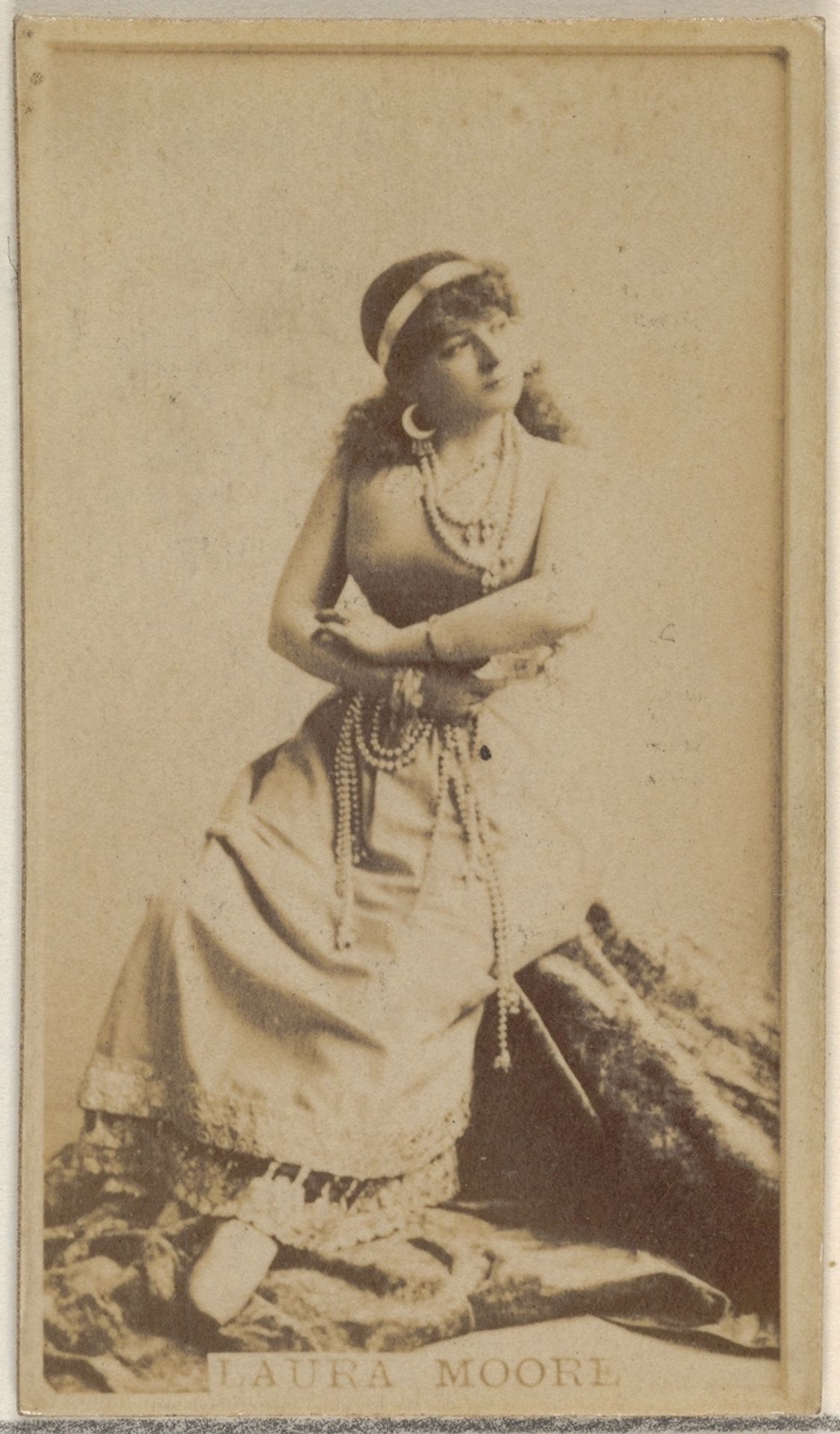Laura Moore, from the Actors and Actresses series (N45, Type 8) for Virginia Brights Cigarettes by Allen & Ginter