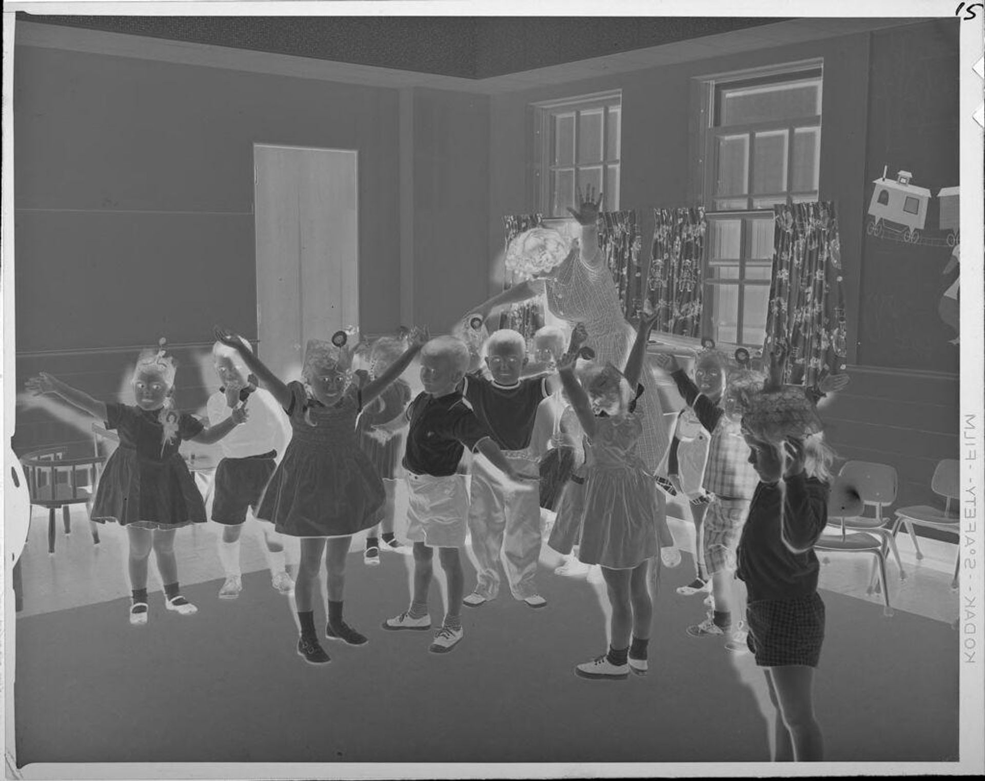 Untitled (children dancing in classroom) by Lucian and Mary Brown