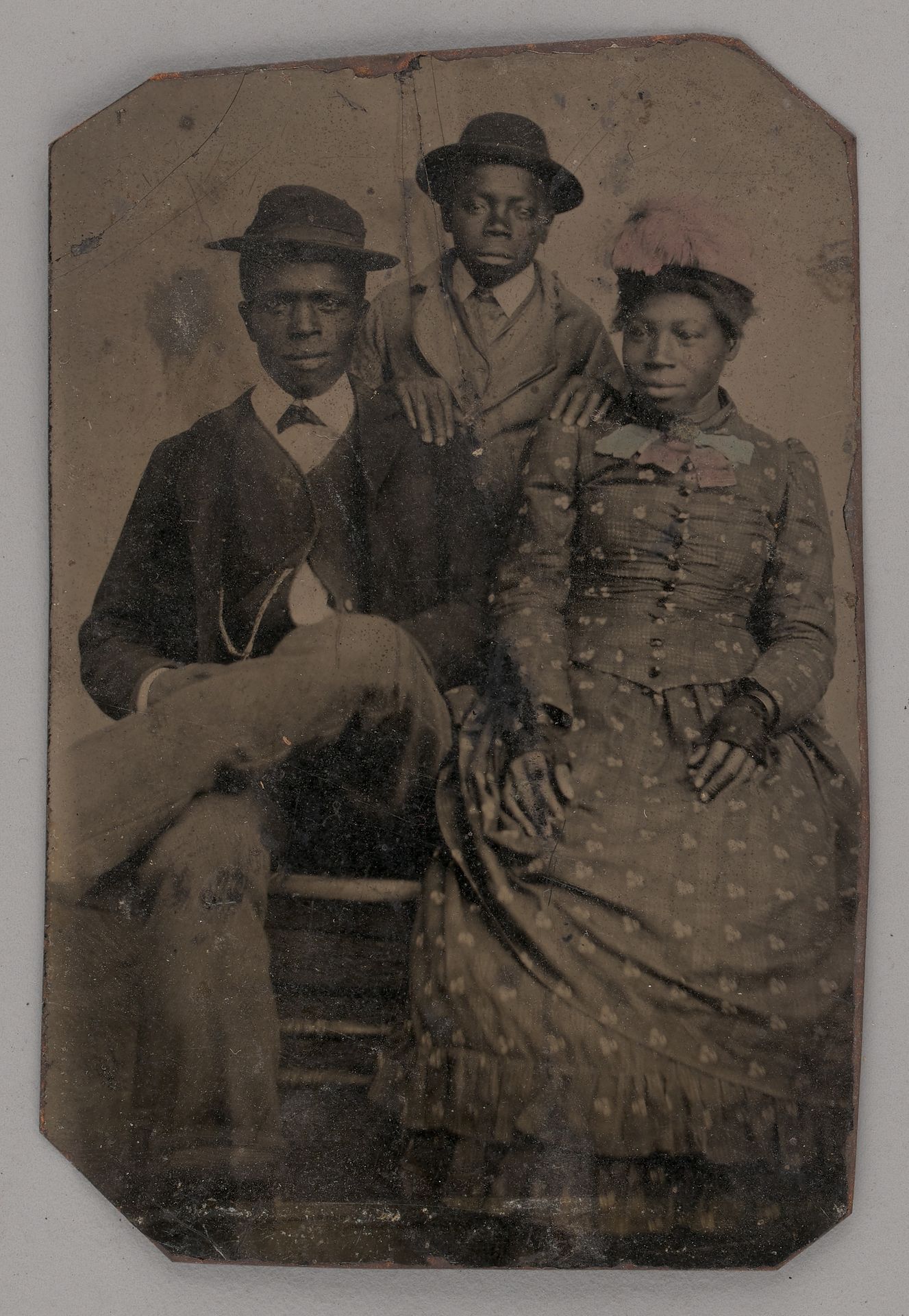 Untitled (Portrait of Two Young Men and One Young Woman) by Anonymous