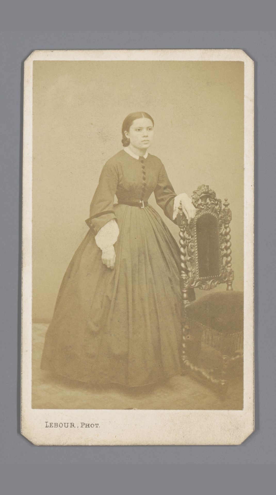 Portret van een onbekende vrouw bij een stoel by Alphonse Joseph Lebour