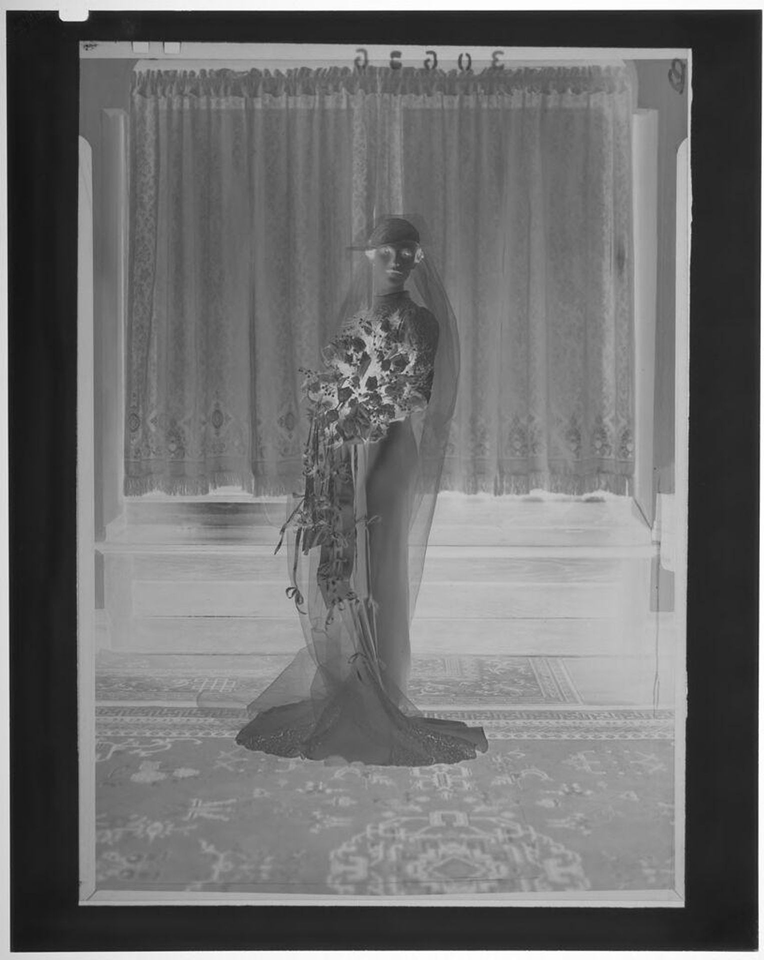 Untitled (bride posed standing in front of curtained windows in elegant room) by Martin Schweig