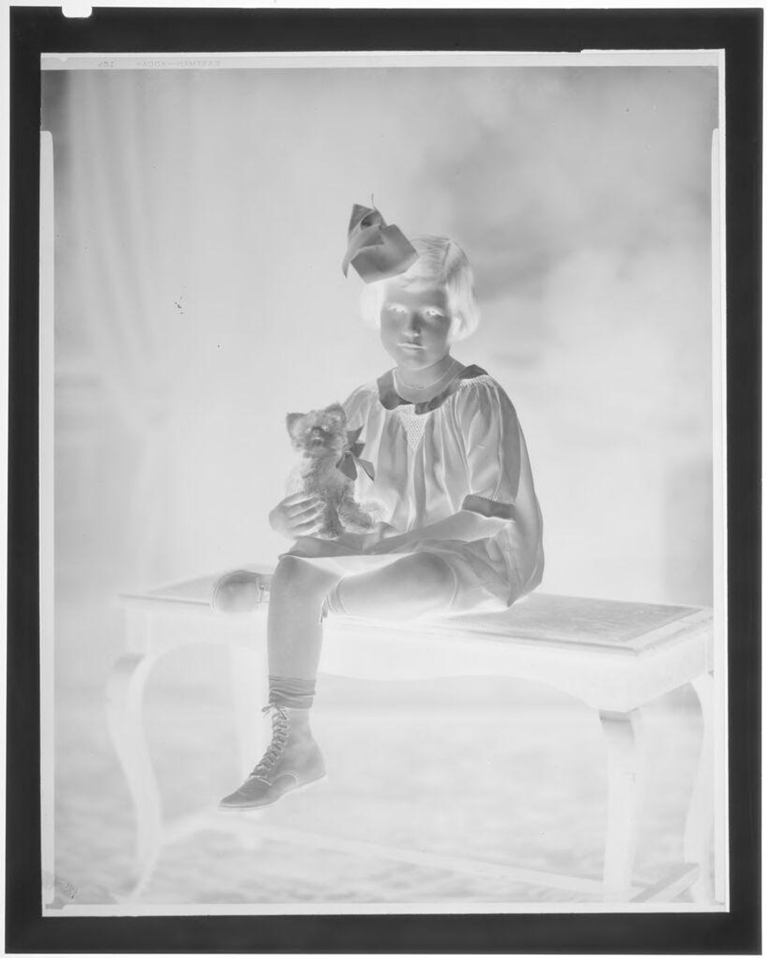 Untitled (portrait of a little girl with her dog) by Hamblin Studio