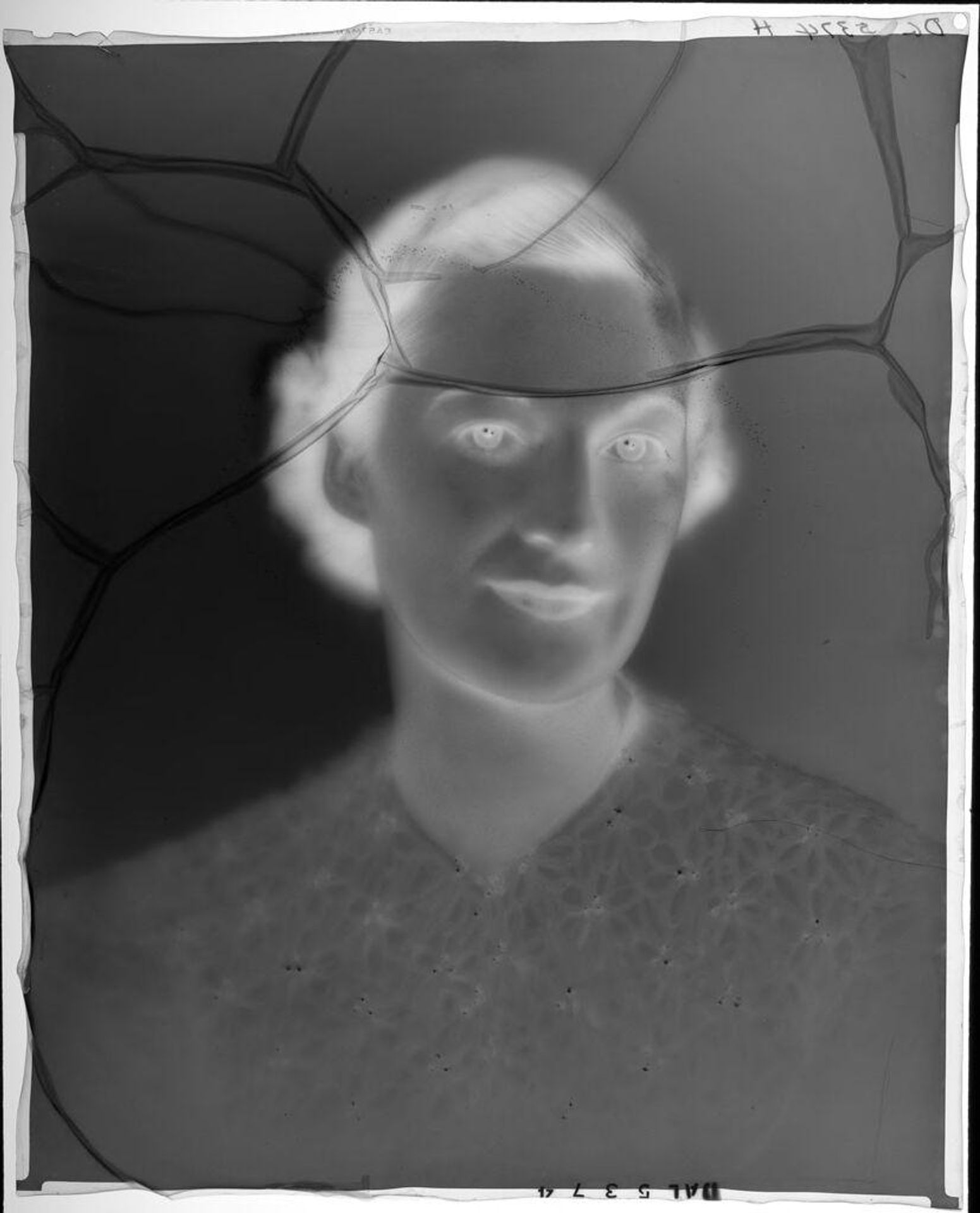 Untitled (portrait of a young woman in dress with floral pattern) by Paul Gittings