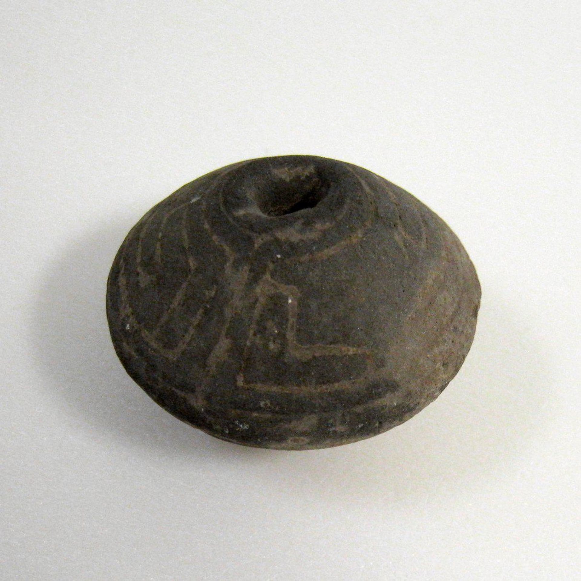 Spindle Whorl by Anonymous