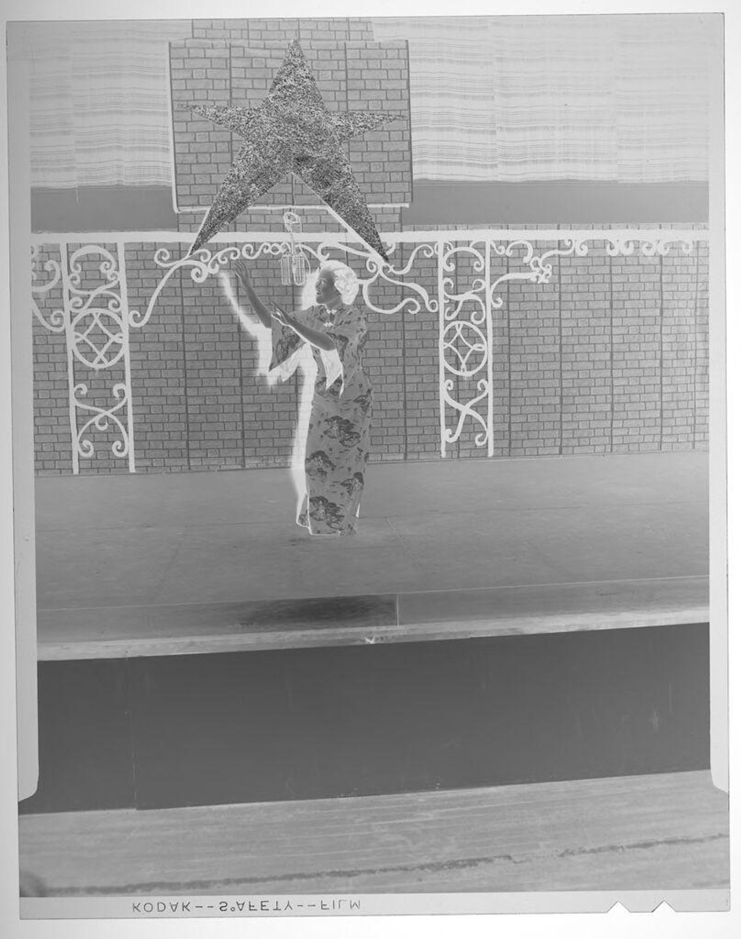 Untitled (woman in Asian dress dancing on stage) by Martin Schweig