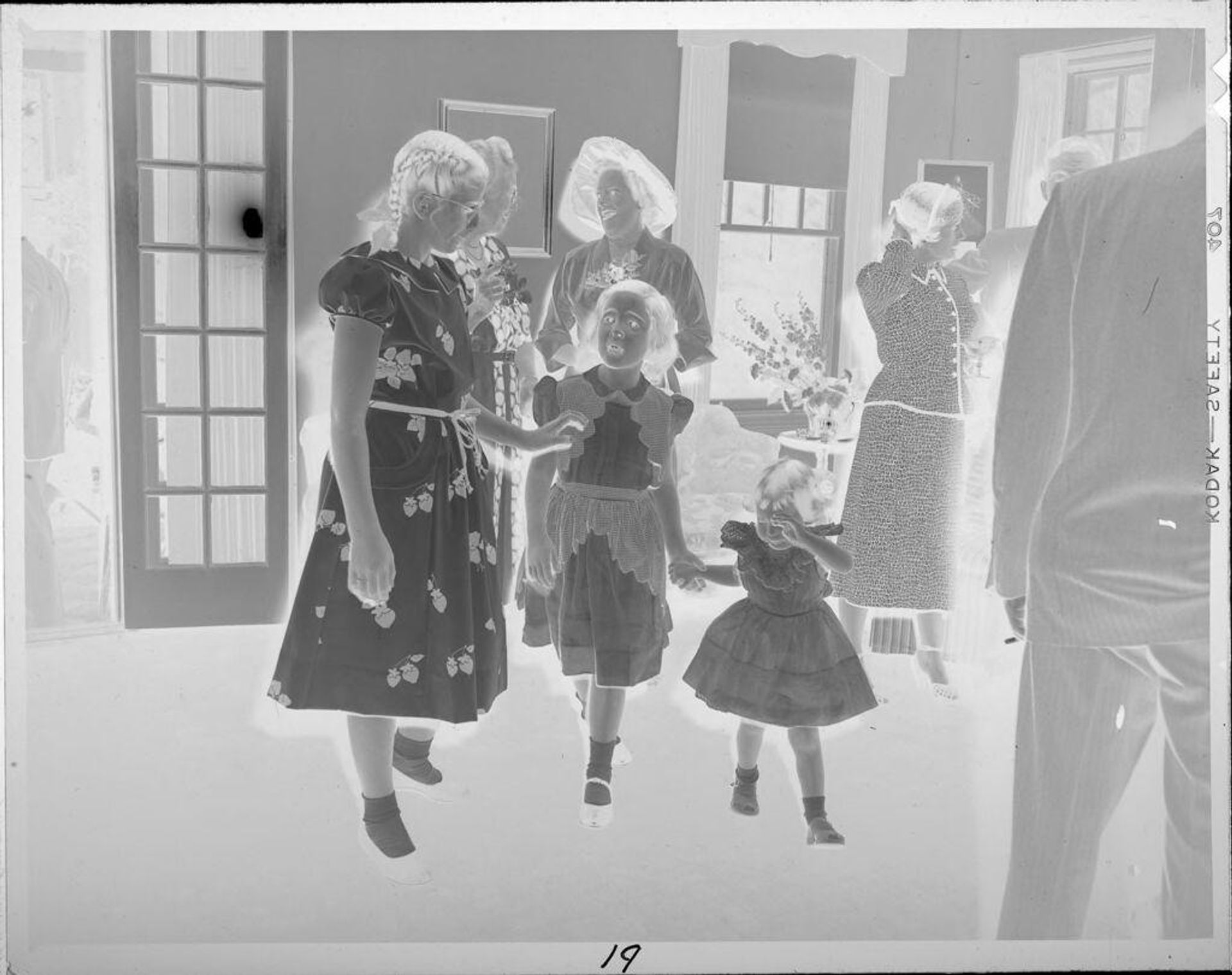Untitled (family in living room) by Lucian and Mary Brown