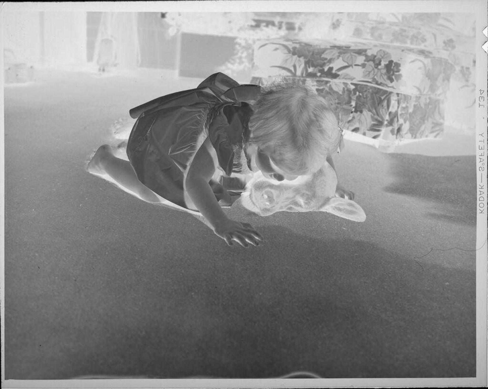 Untitled (girl on floor with dog) by Lucian and Mary Brown