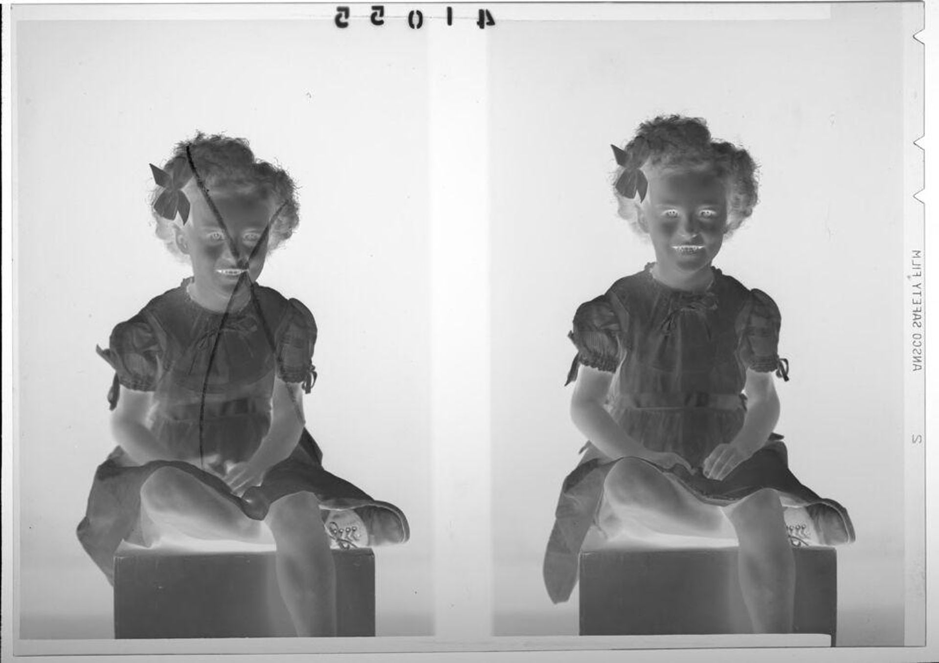 Untitled (double studio portrait of young girl wearing dress and bow in hair) by Martin Schweig