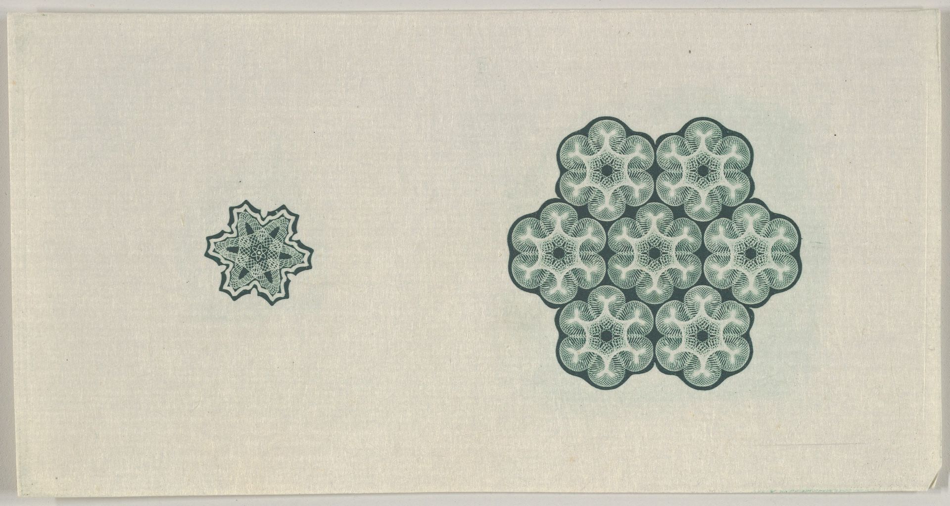 Banknote motif: two six-lobed lathe work ornaments by Cyrus Durand