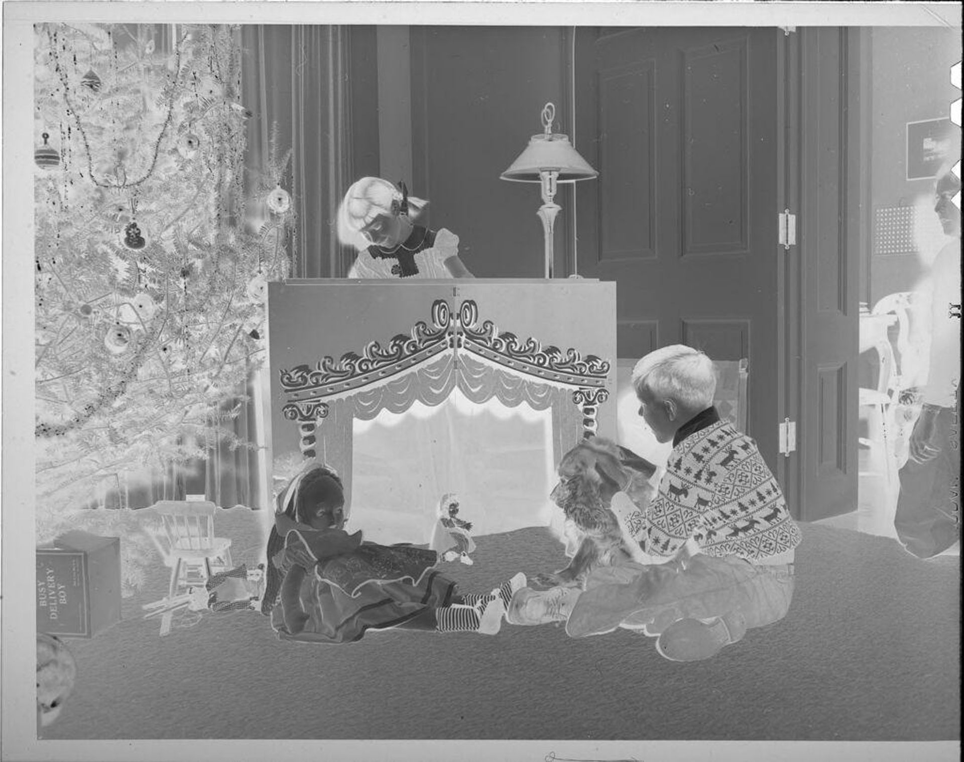 Untitled (children playing with puppet theater) by Lucian and Mary Brown