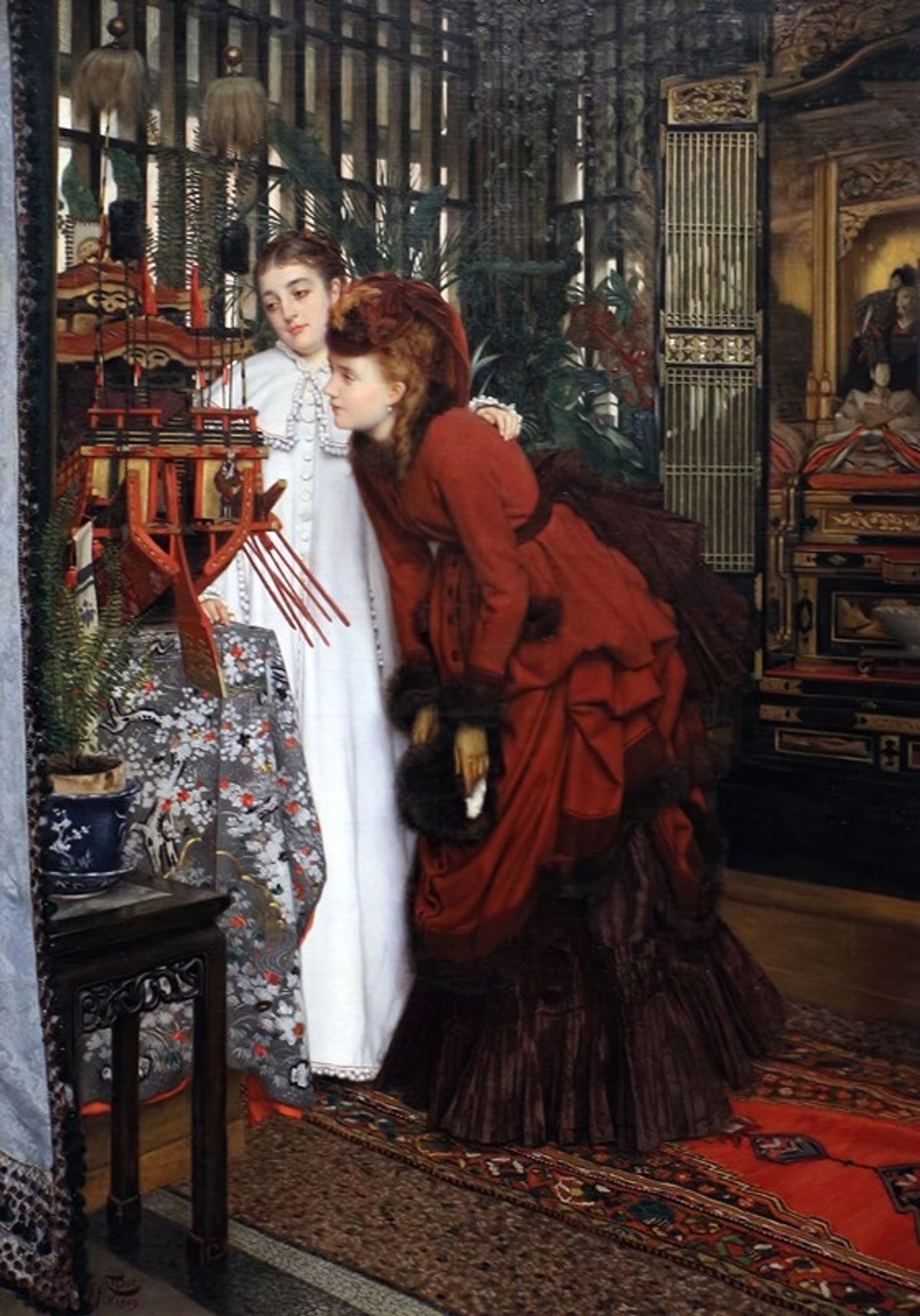 Young woman looking at Japanese items by James Tissot