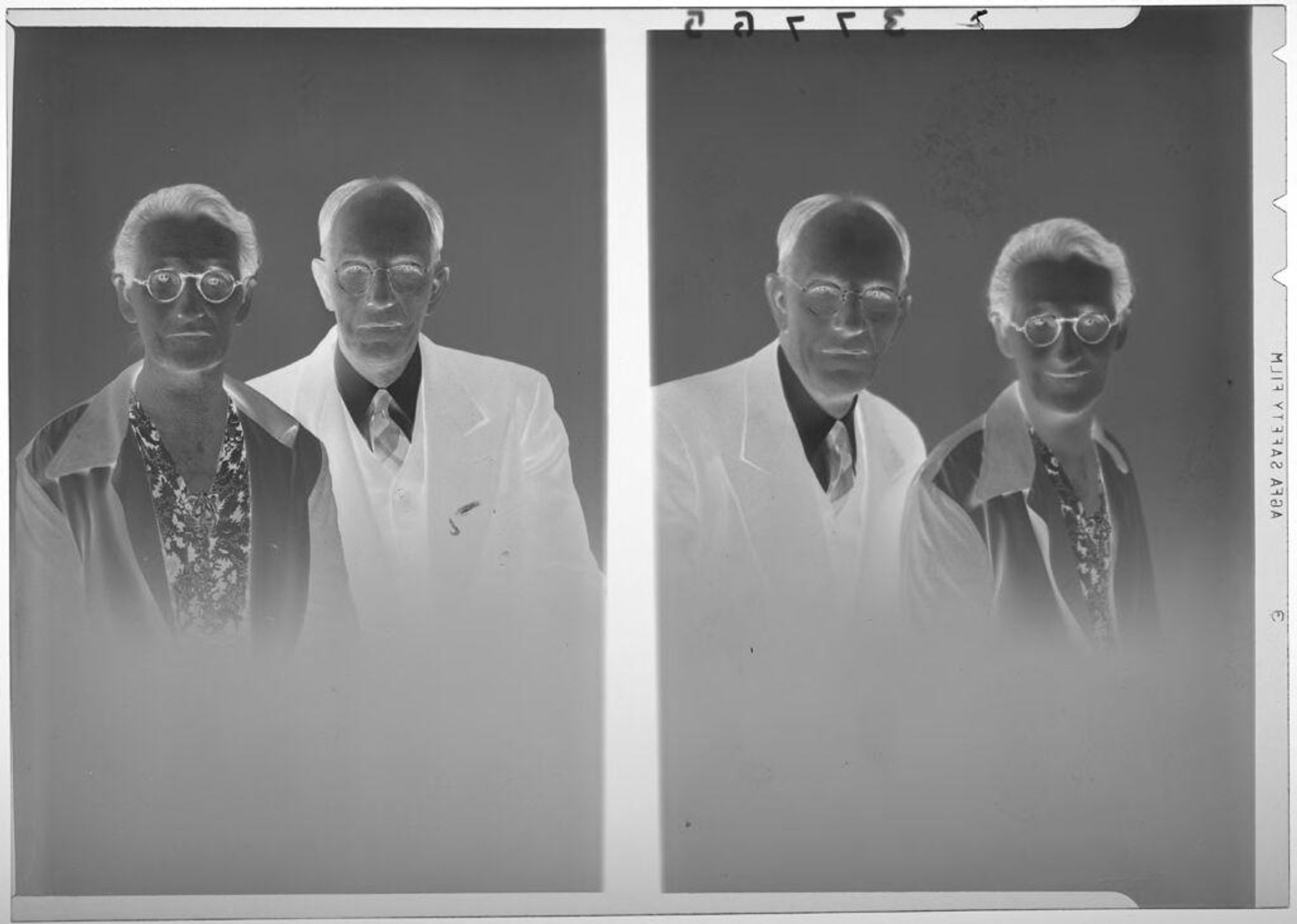Untitled (double studio portrait of older couple wearing glasses) by Martin Schweig