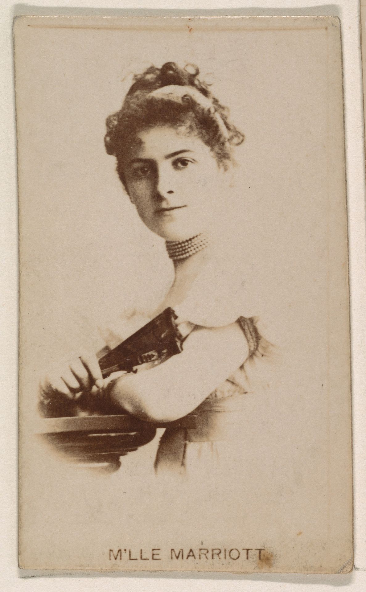 M'lle Marriott, from the Actresses series (N245) issued by Kinney Brothers to promote Sweet Caporal Cigarettes by Kinney Brothers Tobacco Company