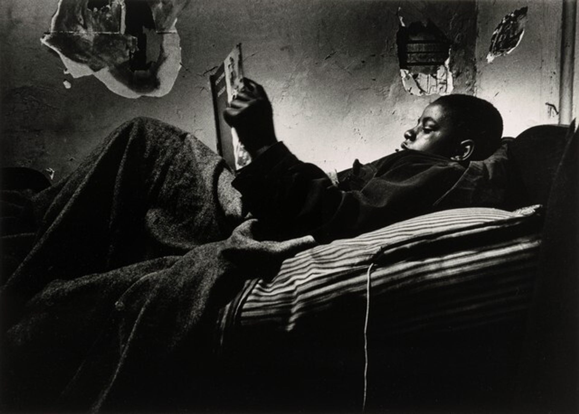 Norman Jr. Reading in Bed by Gordon Parks
