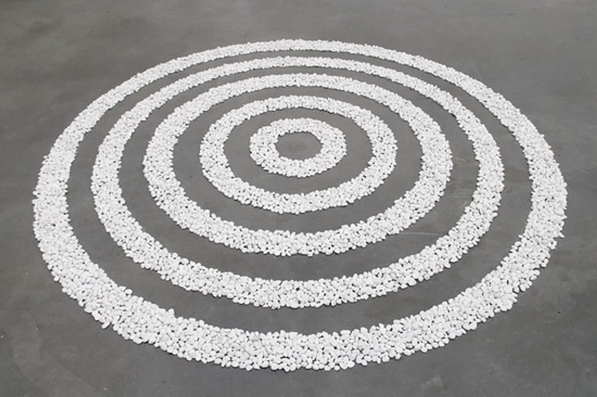 Small White Pebble Circles Date by Richard Long