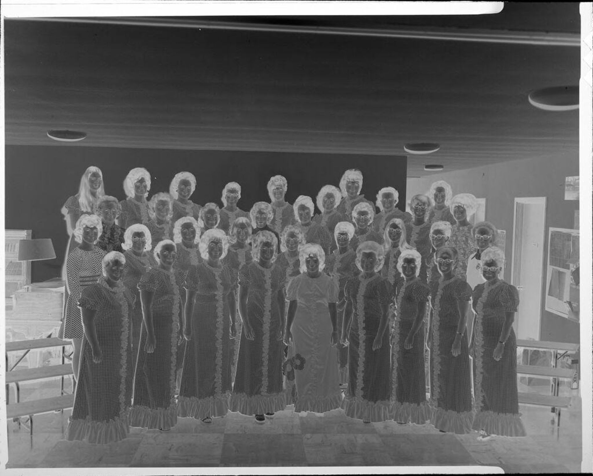 Untitled (women's singing group wearing matching dresses) by Ken Whitmire Associates