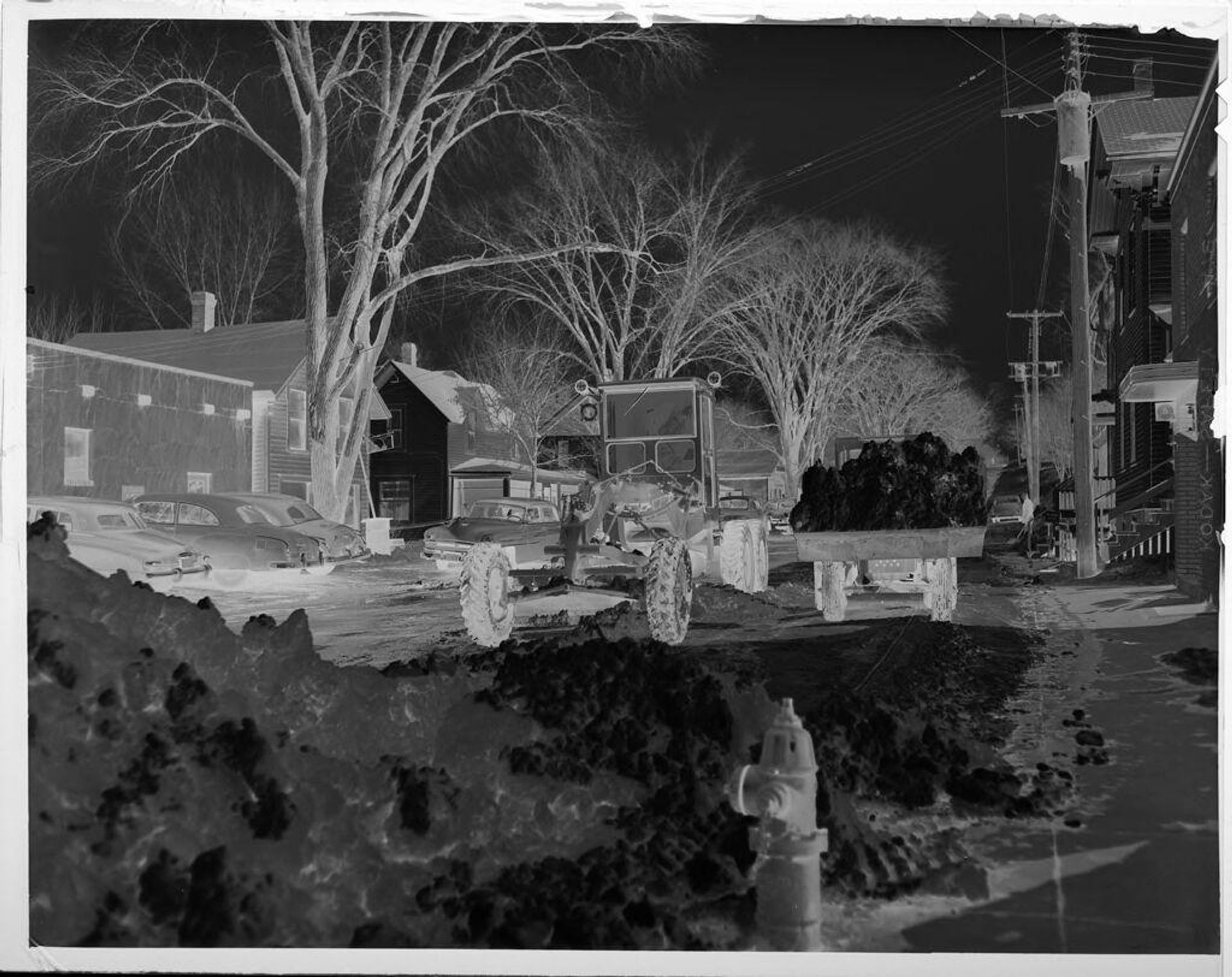 Untitled (trucks plowing large snow piles) by Lucian and Mary Brown