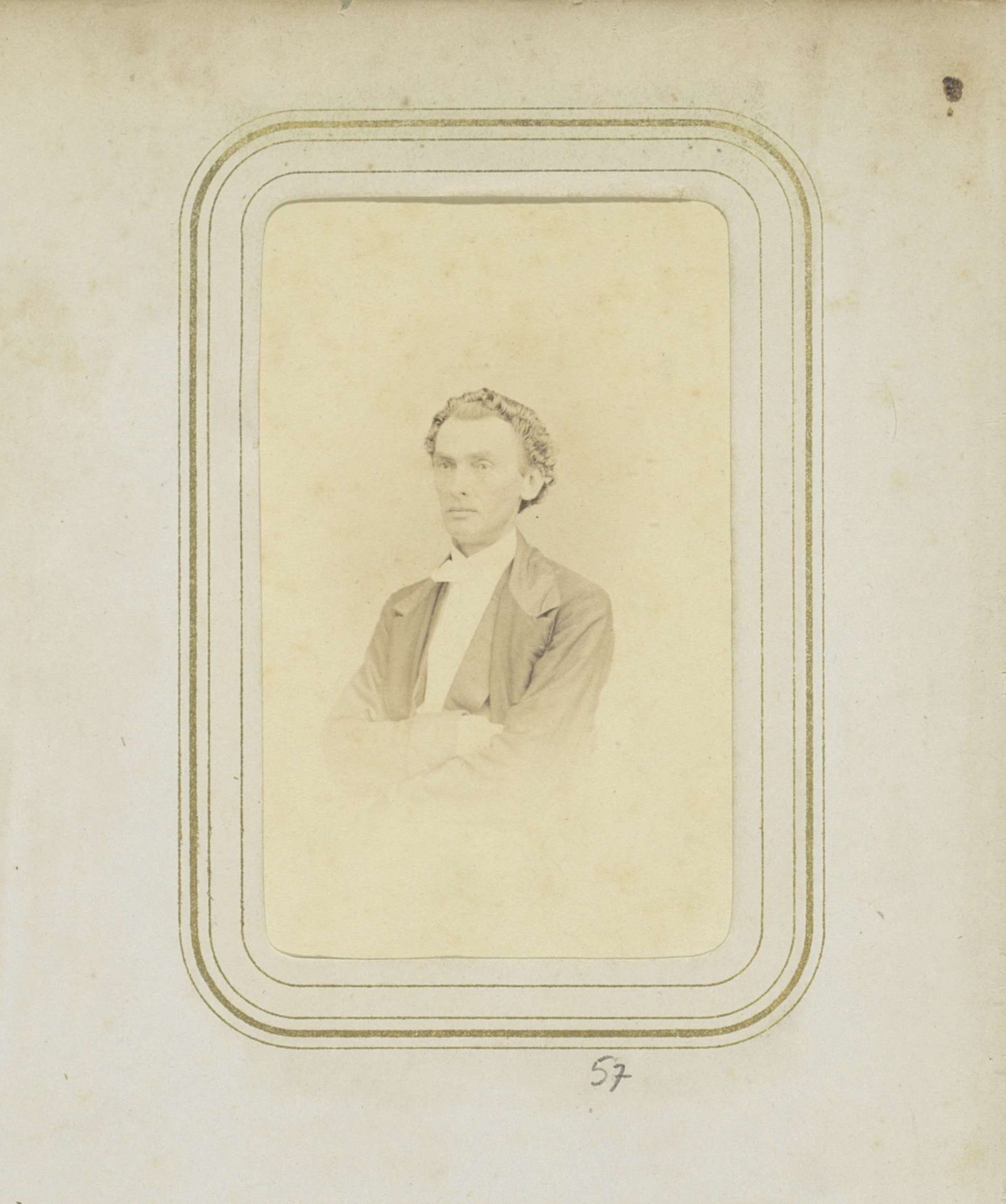 Portret van een man met golvend haar in een jas by James Page