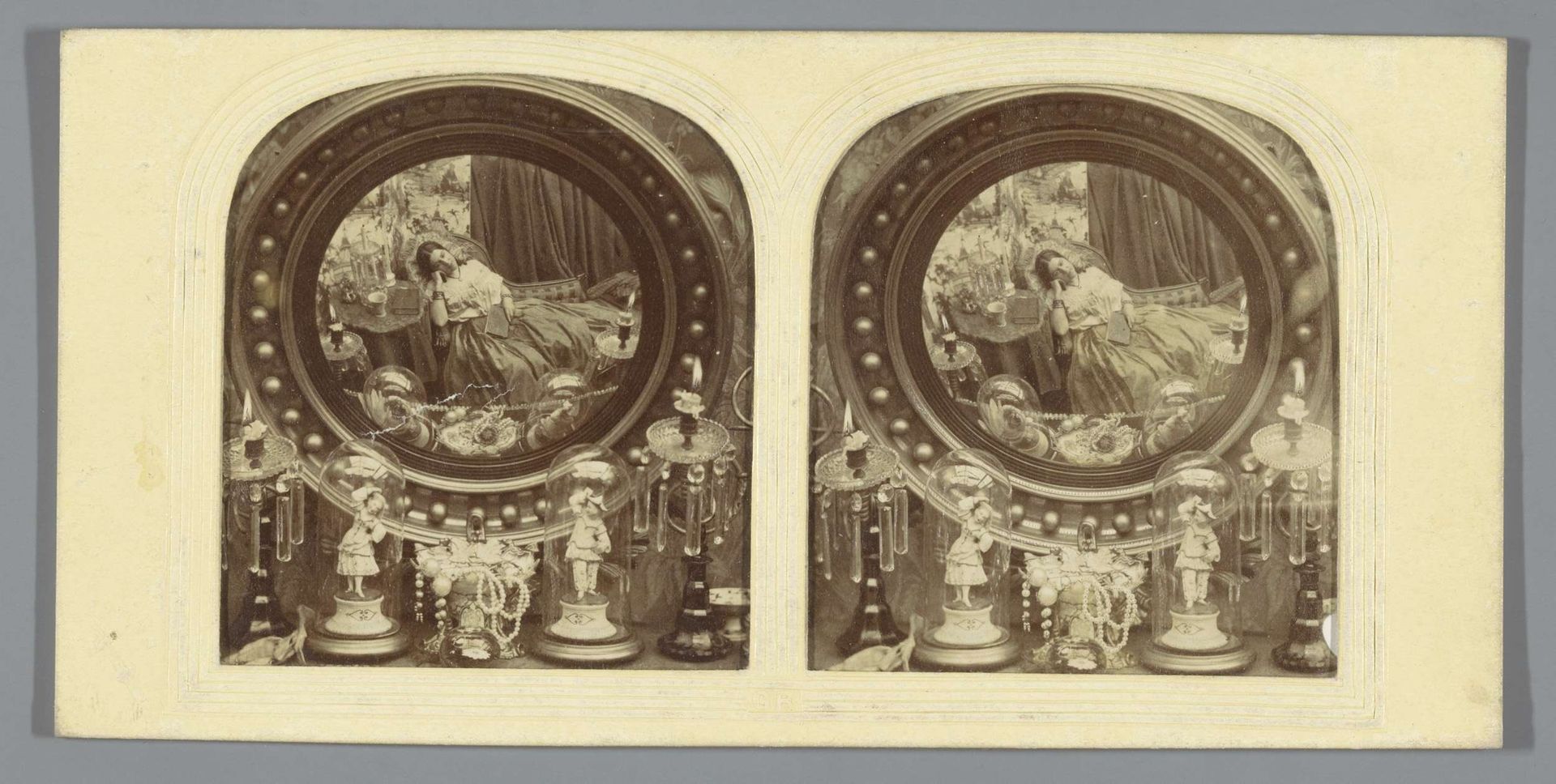 Stilleven met kandelaren, beeldhouwwerk, sieraden en een spiegel met de reflectie van een jonge vrouw by John Reynolds