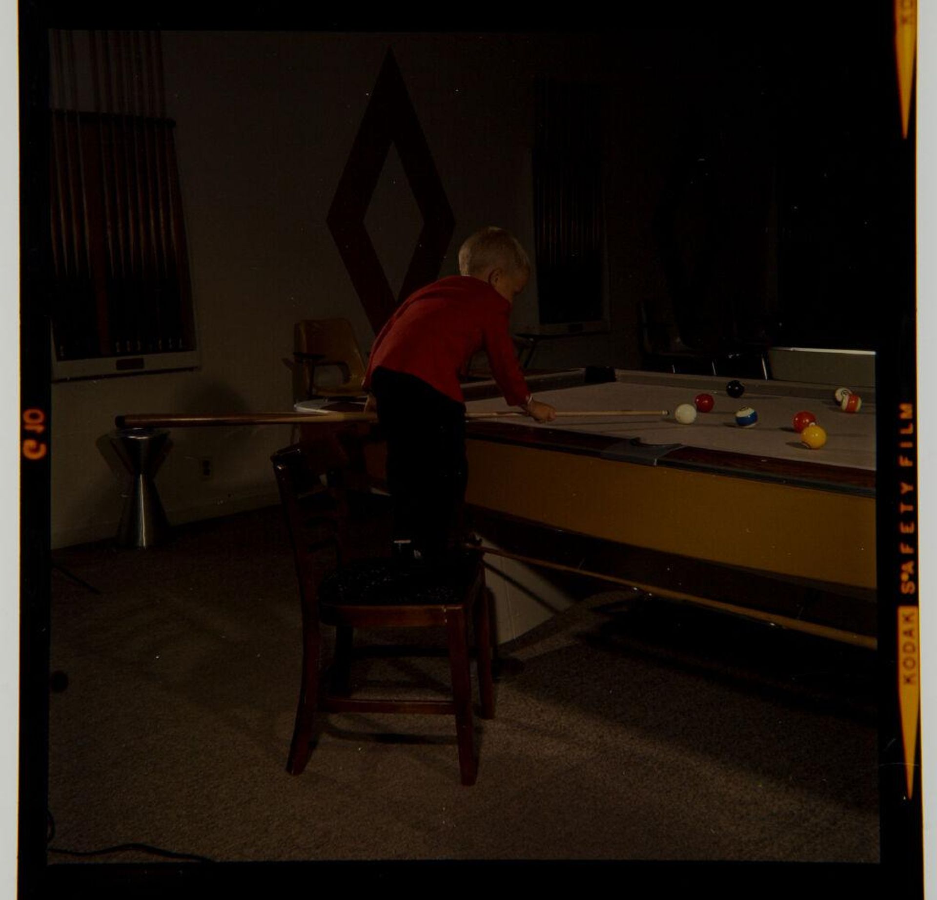 Untitled (woman or child playing pool) by Jack Gould