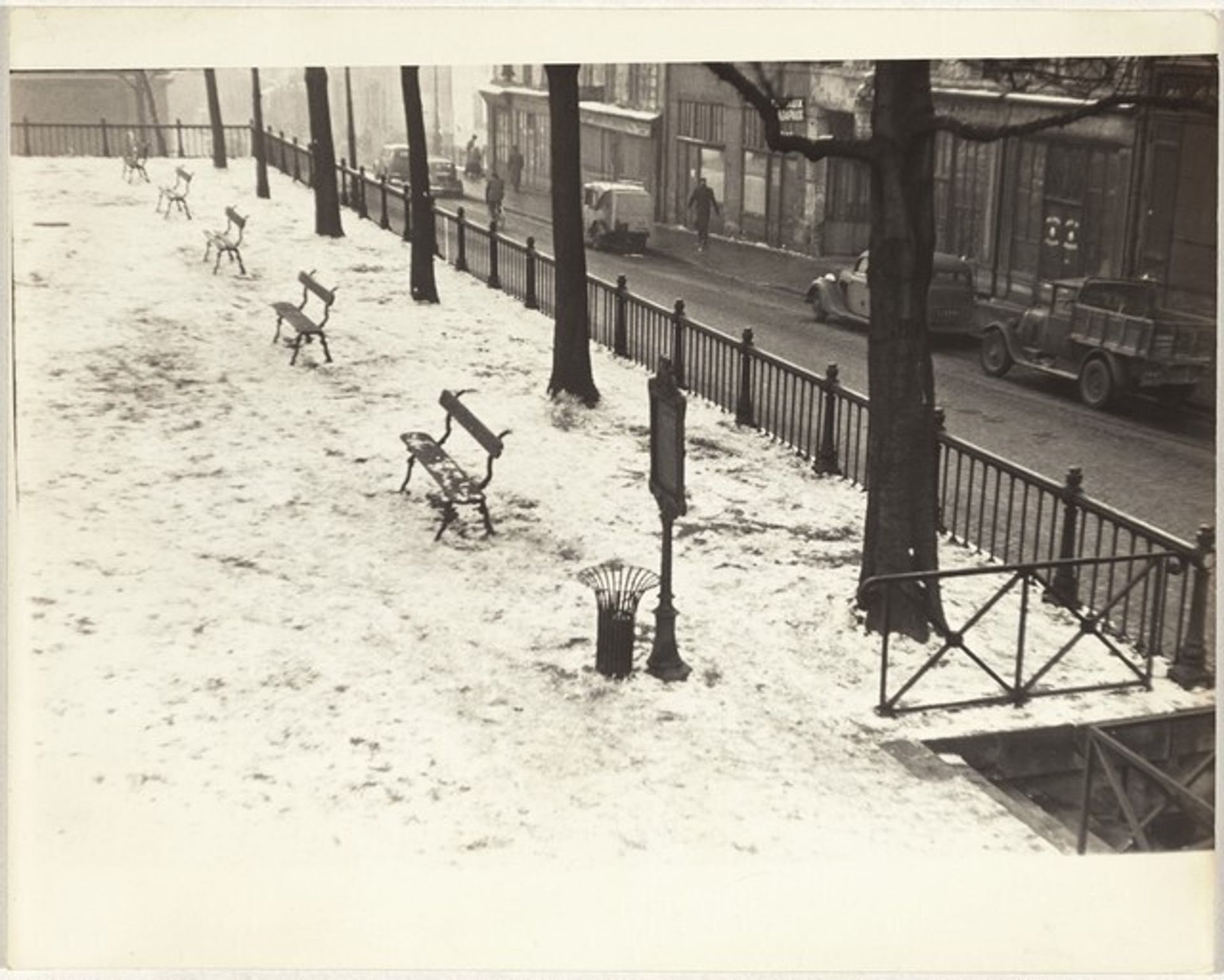 Park benches in snow, Paris by Robert Frank