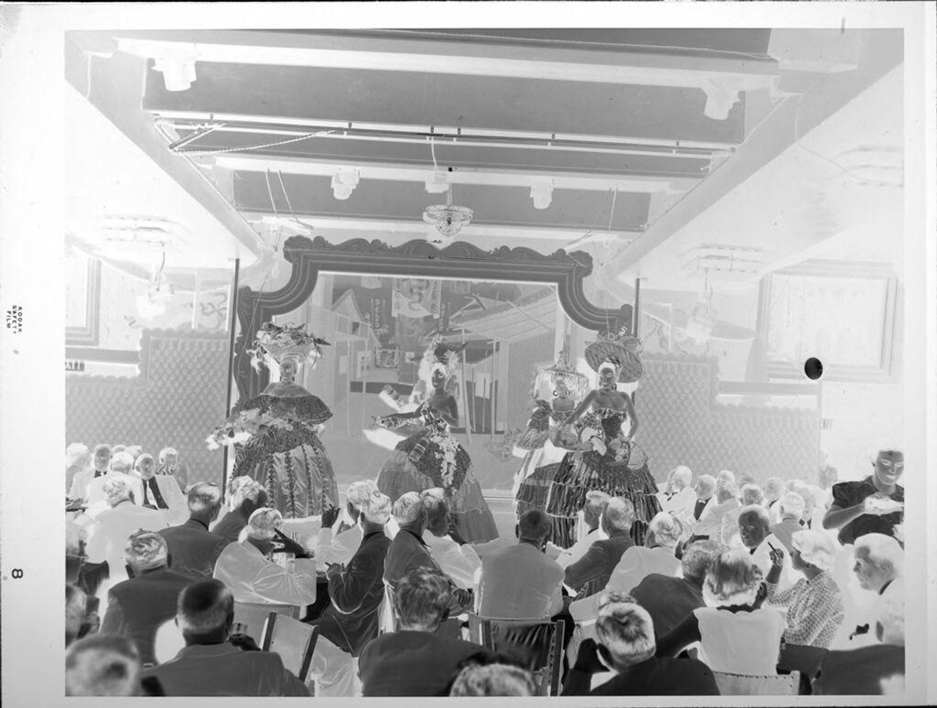 Untitled (performers on stage, crowd watching) by Peter James Studio