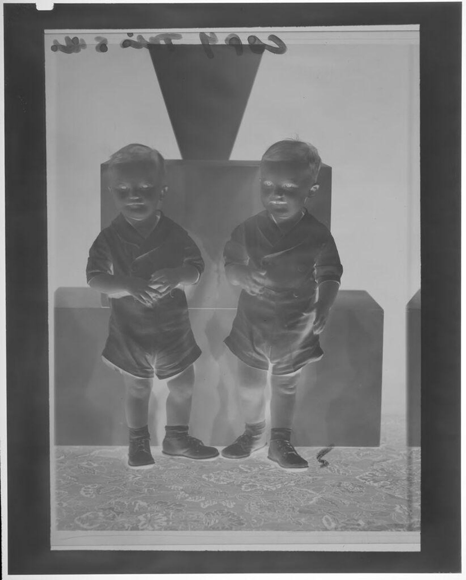 Untitled (studio portrait of two very young boys in matching clothes) by Martin Schweig