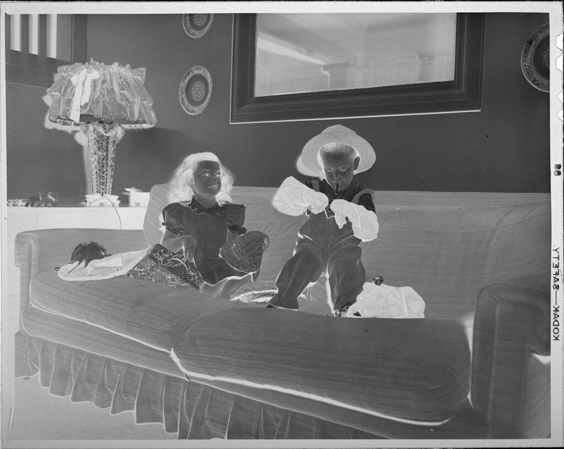 Untitled (children on couch, boy with cigarette) by Lucian and Mary Brown