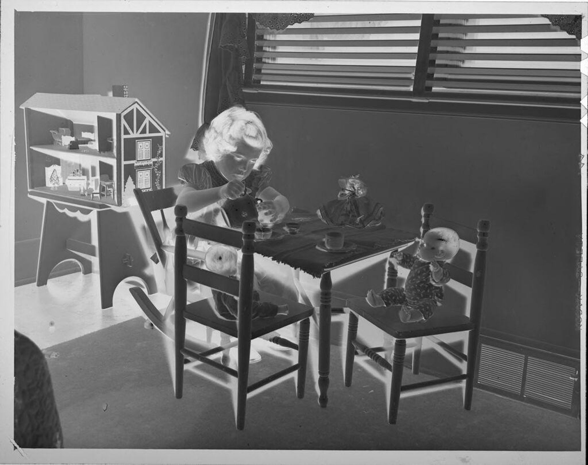 Untitled (girl having tea party with dolls) by Lucian and Mary Brown
