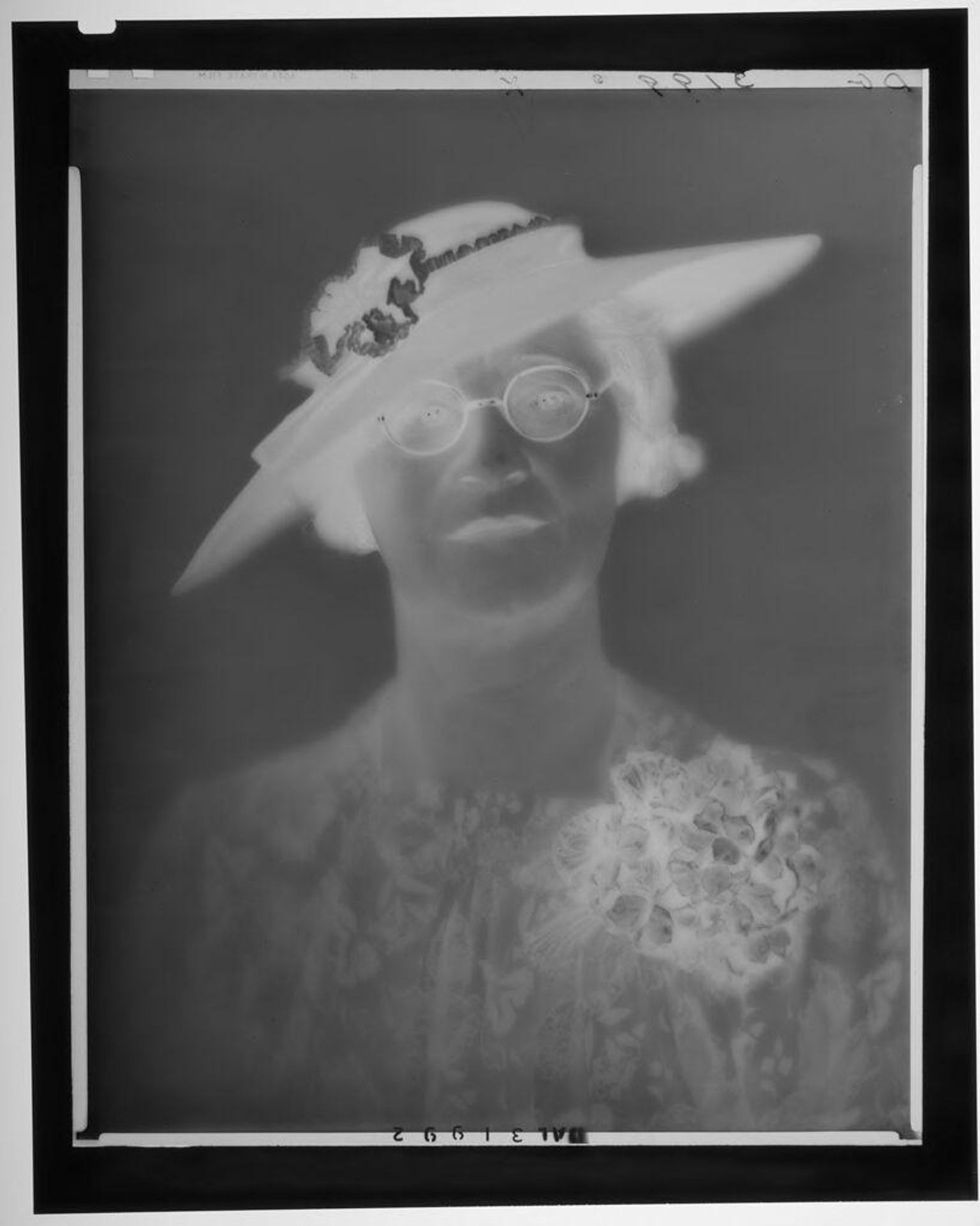 Untitled (woman in hat and glasses wearing large corsage) by Paul Gittings