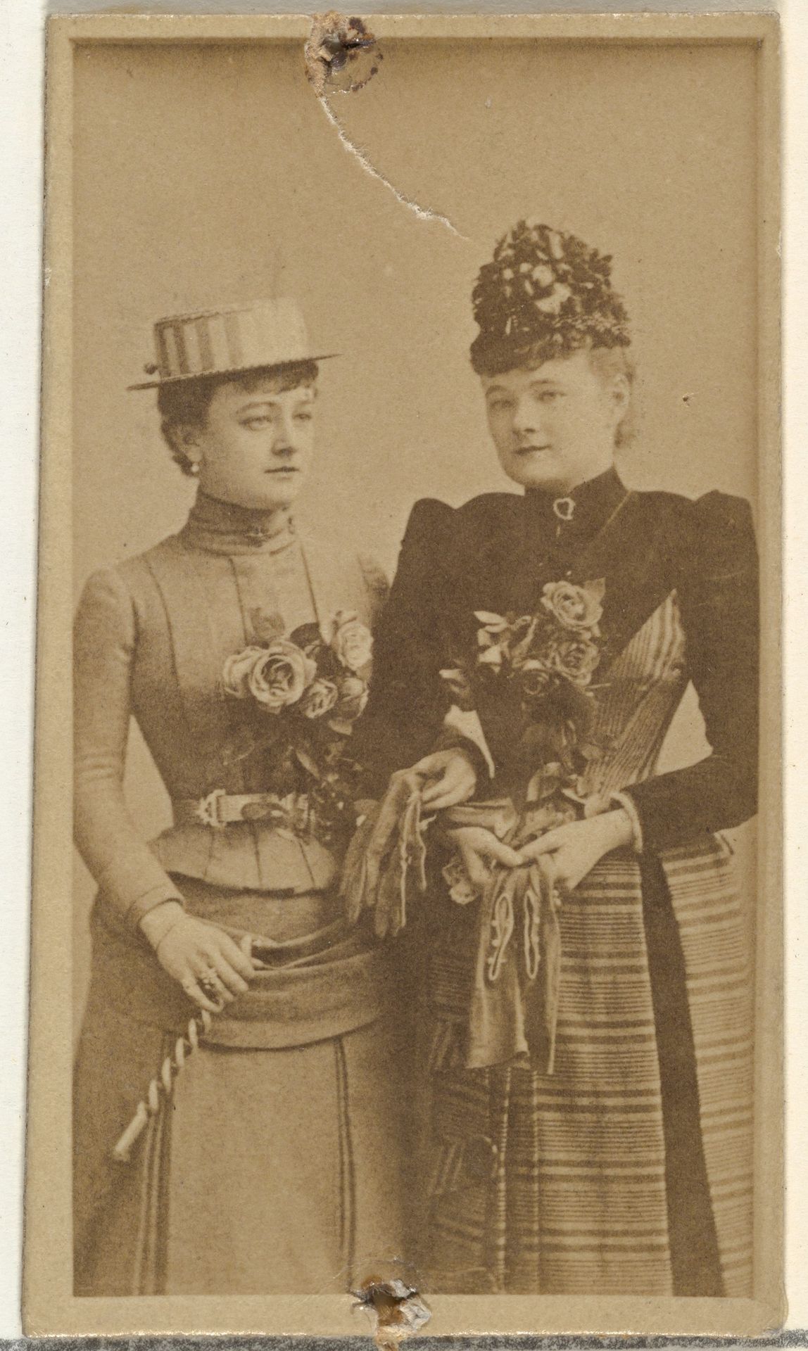 [Two actresses holding gloves], from the Actors and Actresses series (N145-8) issued by Duke Sons & Co. to promote Duke Cigarettes by W. Duke, Sons & Co.