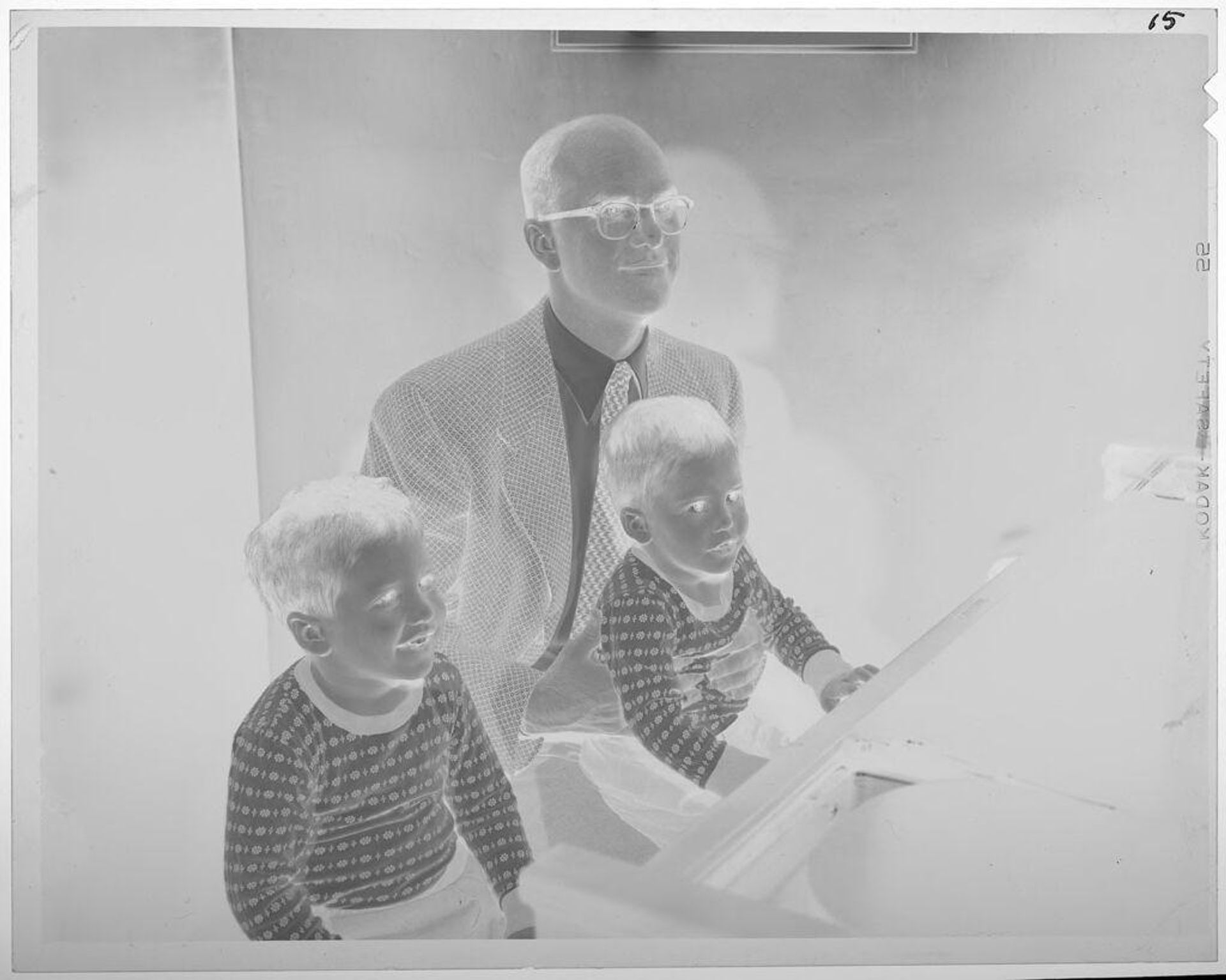 Untitled (seated man and two little boys) by Lucian and Mary Brown