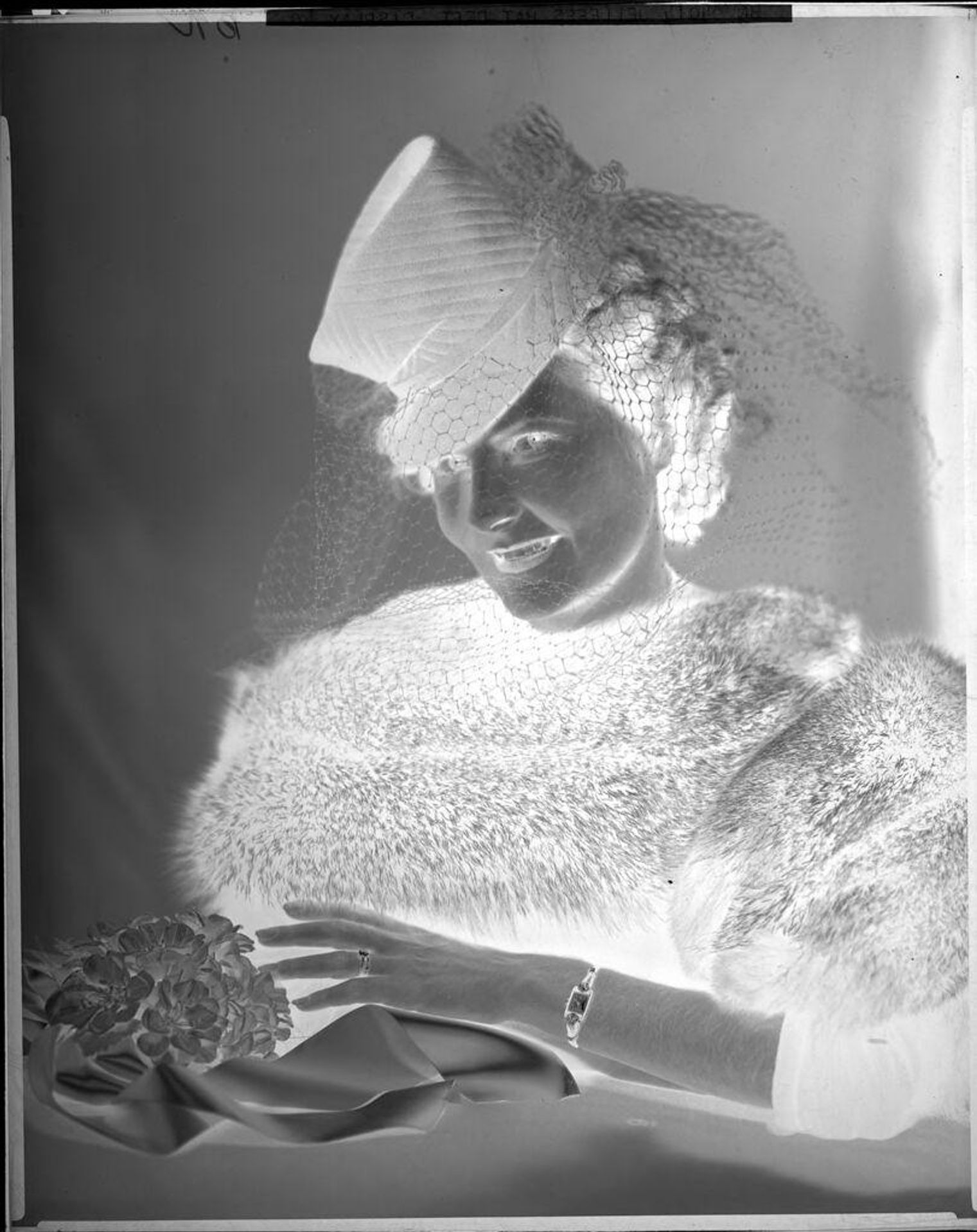 Untitled (advertising, woman posed, hat with veil, watch, bouquet of flowers) by Harris & Ewing
