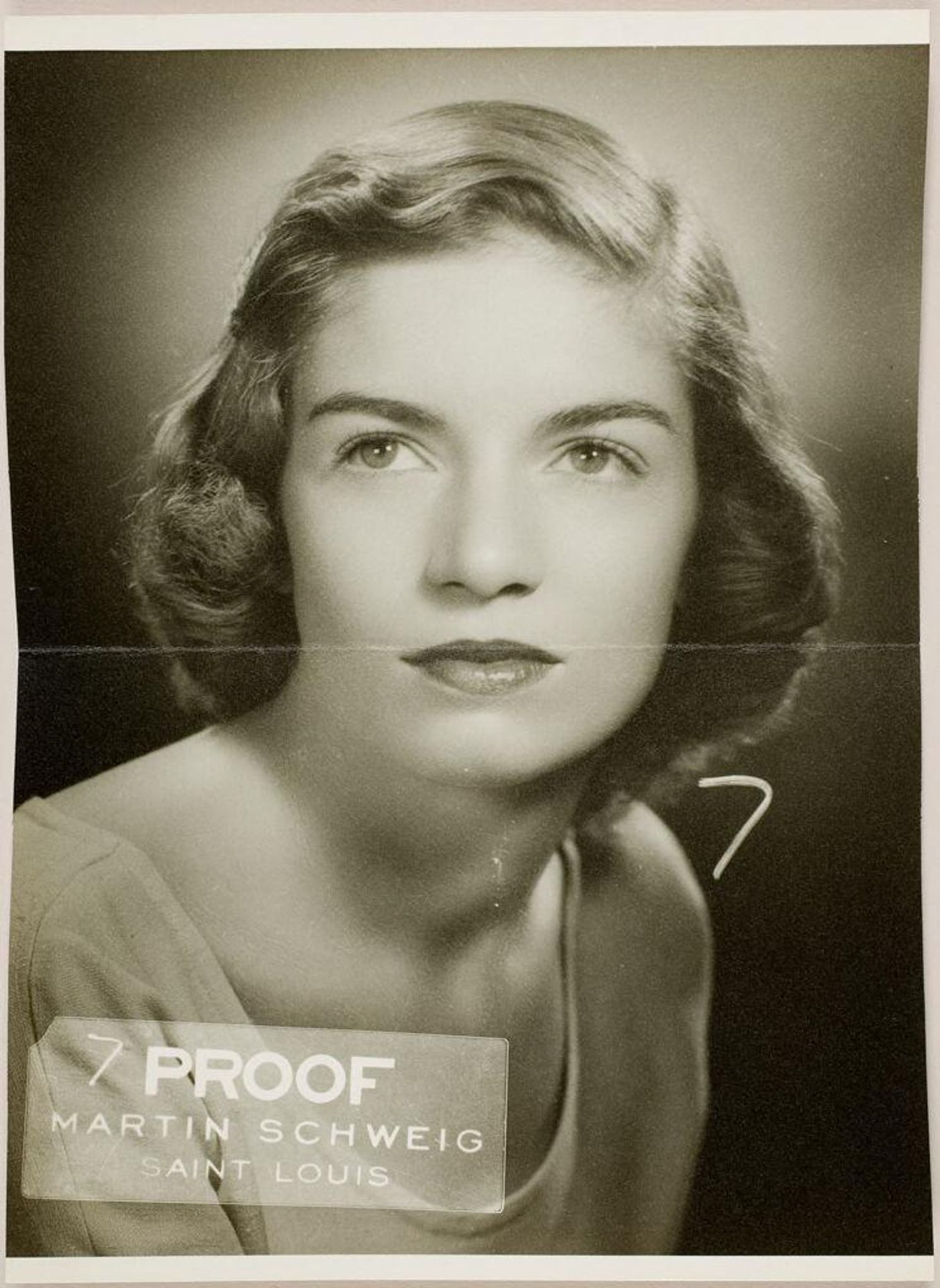 Untitled (studio portrait of young woman in light dress) by Martin Schweig