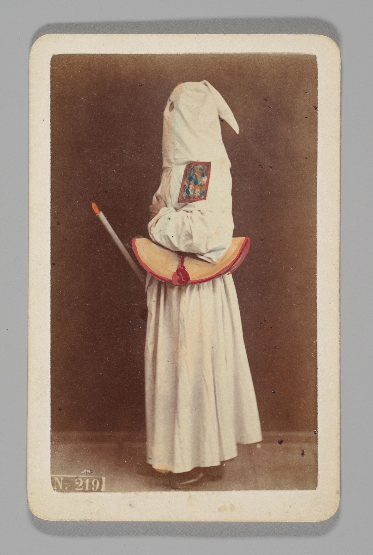 [Studio Portrait: Person Wearing White Robe and Face Covering Hood, Naples] by Giorgio Conrad