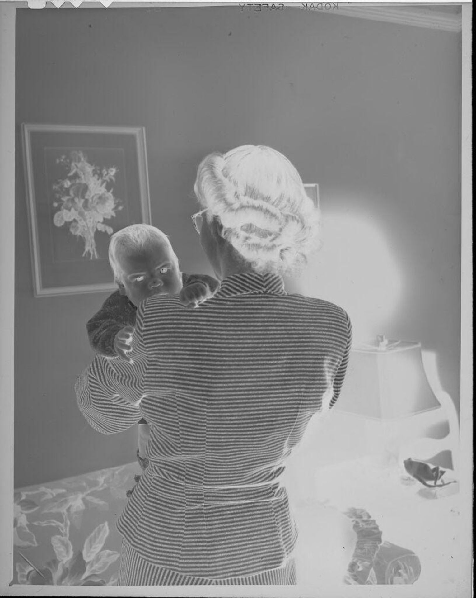 Untitled (woman holding baby) by Lucian and Mary Brown