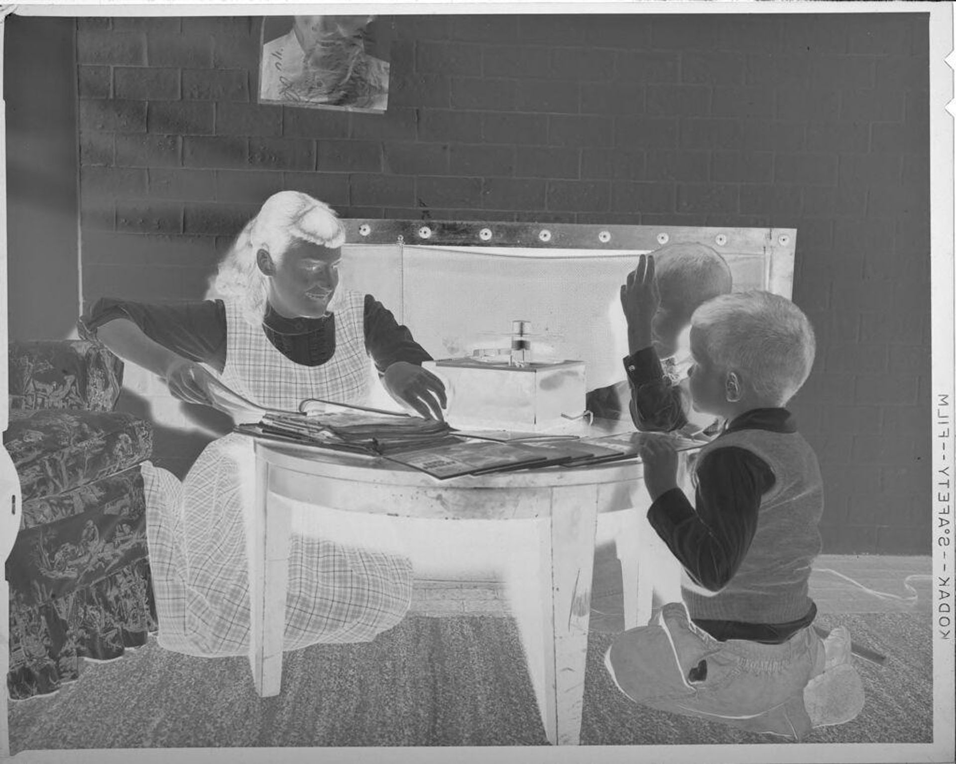 Untitled (children reading magazines) by Lucian and Mary Brown
