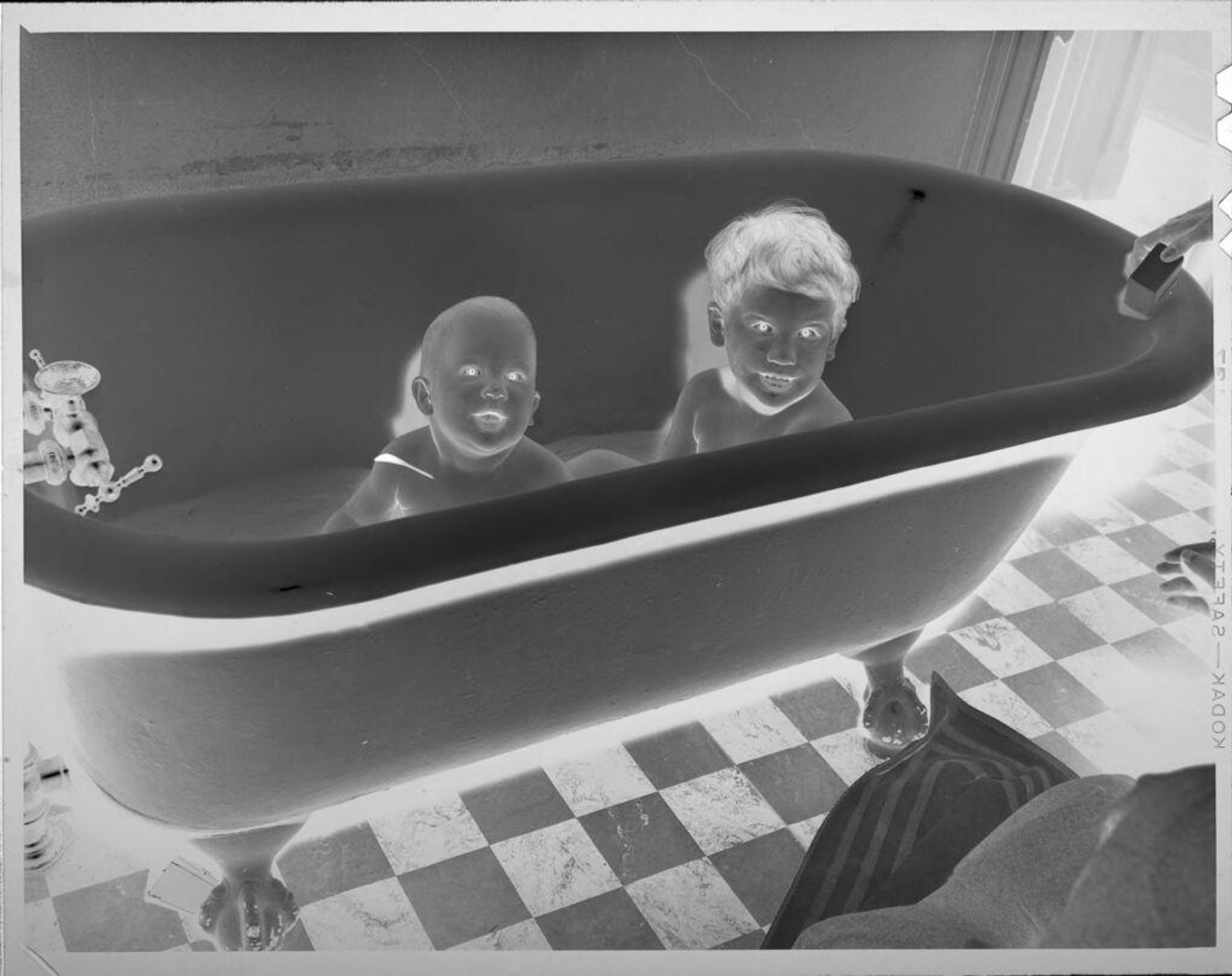 Untitled (baby and boy in bathtub) by Lucian and Mary Brown