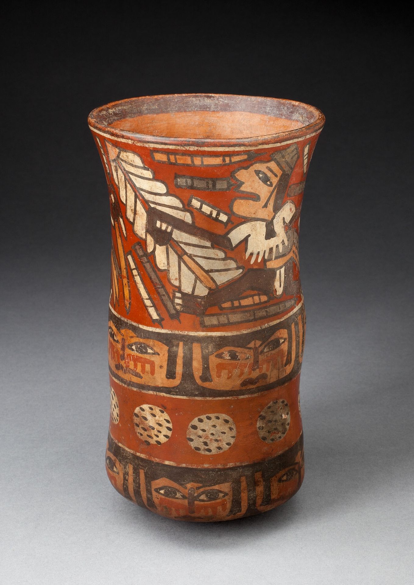 Beaker Depicting Rows of Figures with Weapons and Band of Human Faces by Nazca